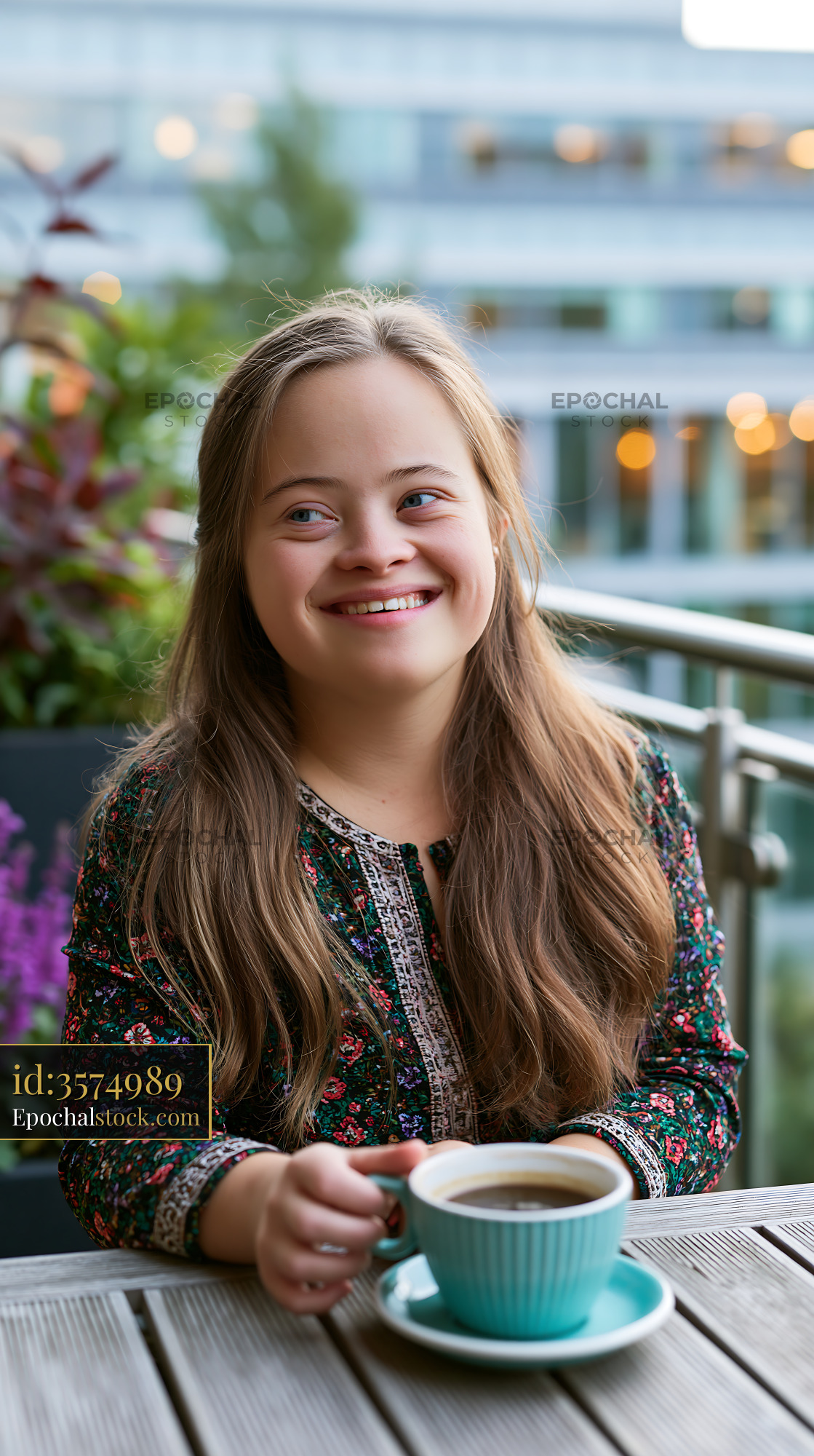 Watermarked full-resolution preview of Happy girl enjoying coffee on a terrace