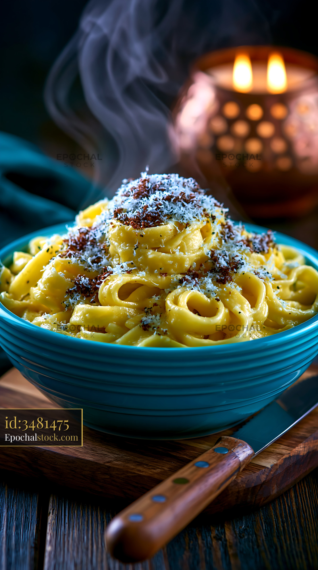 Watermarked full-resolution preview of Creamy pasta served in a blue bowl with cheese and herbs