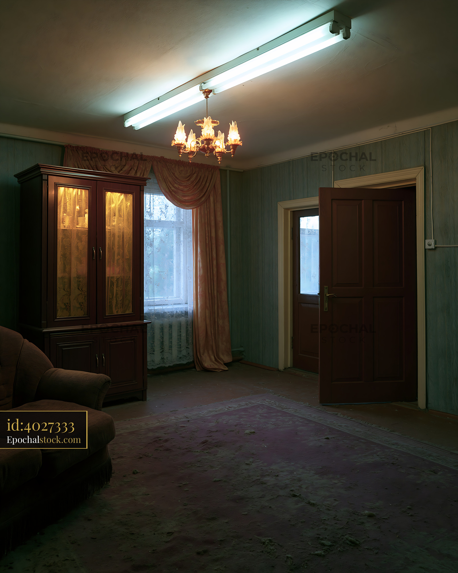 Watermarked full-resolution preview of Interior of a vintage living room with a chandelier and large window