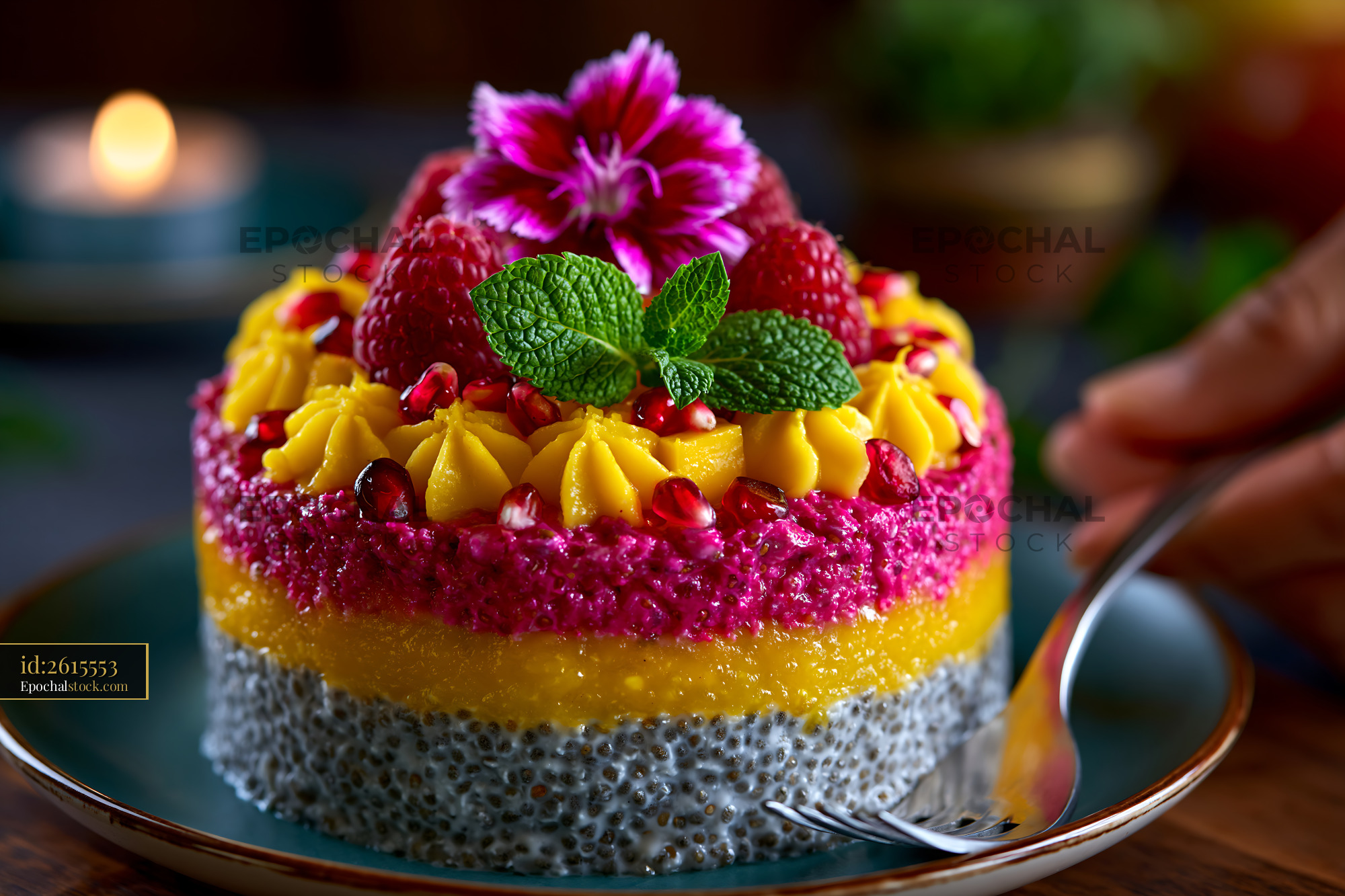 Watermarked full-resolution preview of Colorful layered dessert with fresh fruit and flowers