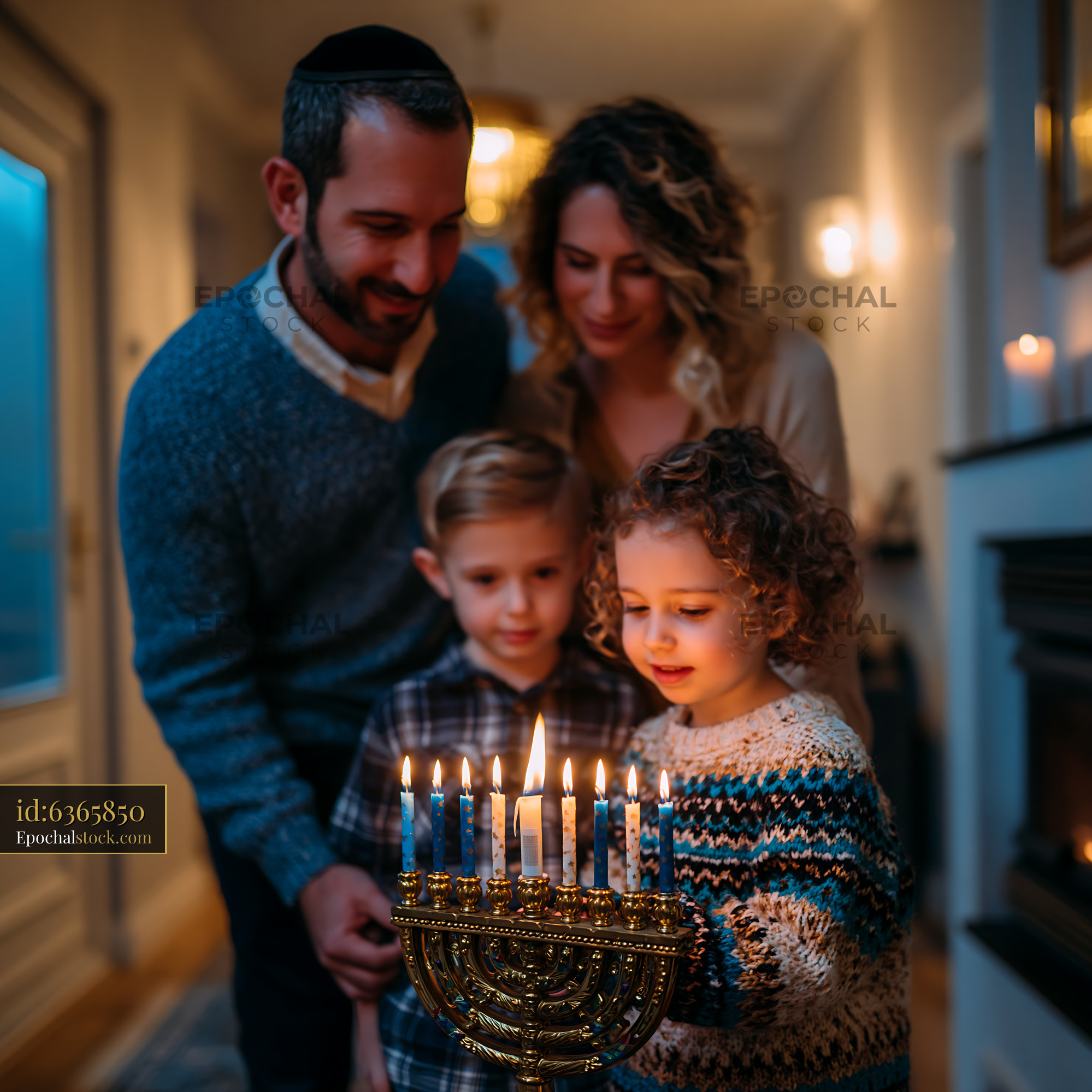 Watermarked full-resolution preview of Family celebrates Hanukkah by lighting menorah at home