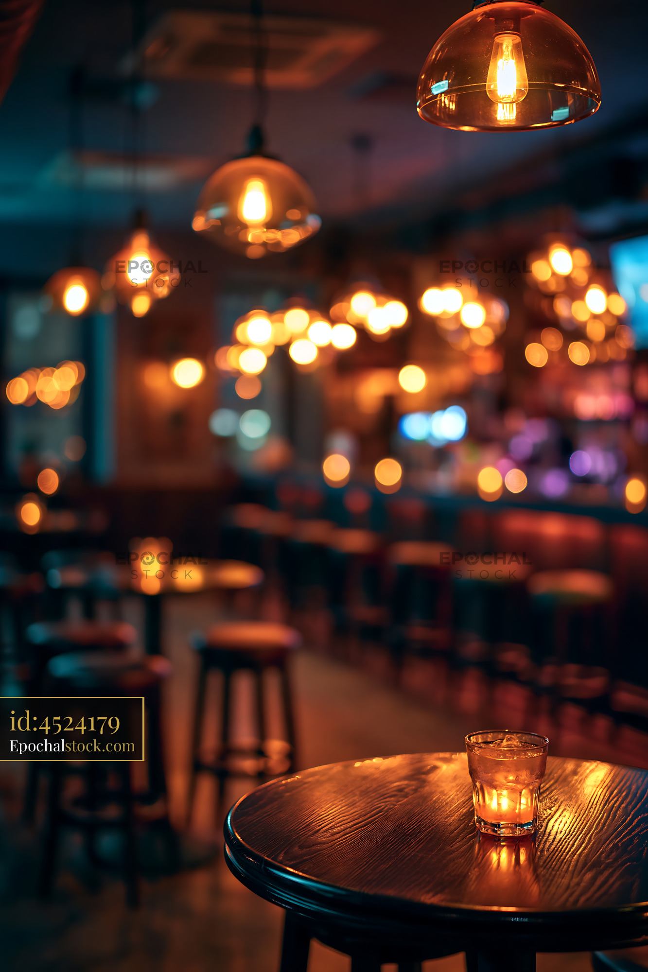 Bar Scene With Warm Lights and Empty Stools at Night - stock photo