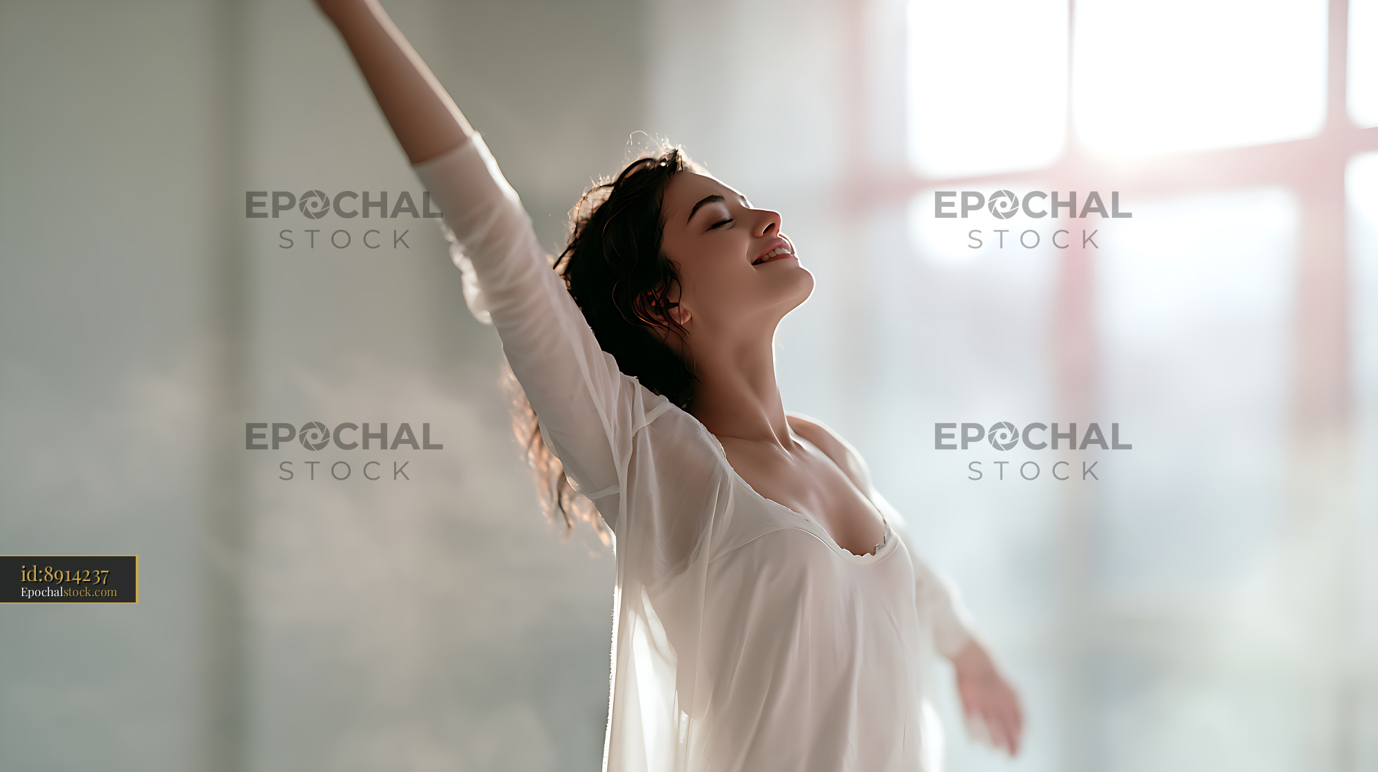 Watermarked full-resolution preview of Joyful woman dancing in a bright room