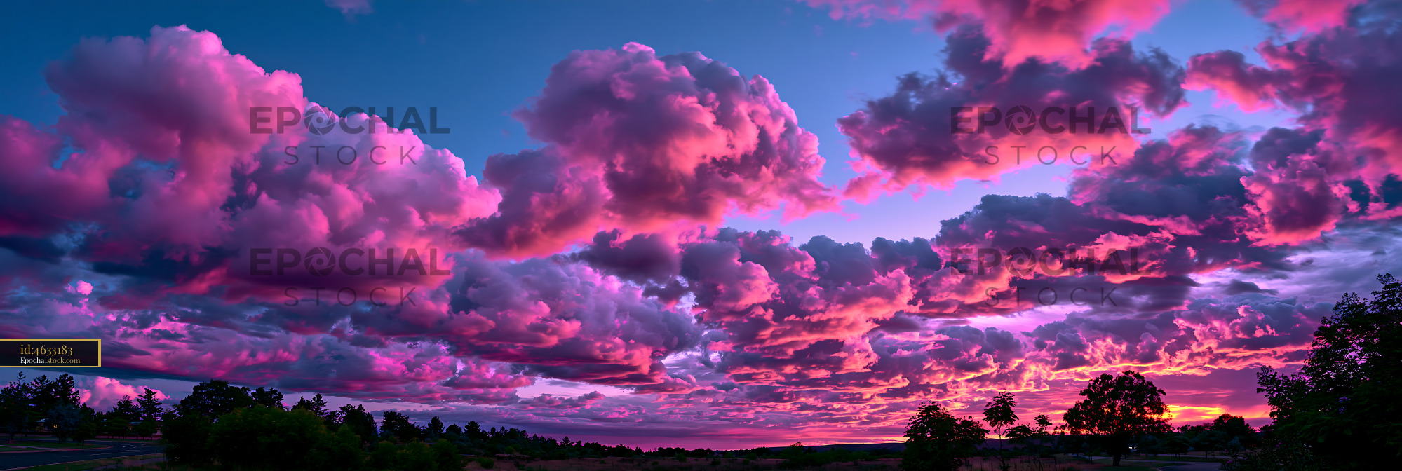 Watermarked full-resolution preview of Vibrant clouds in the evening sky at sunset