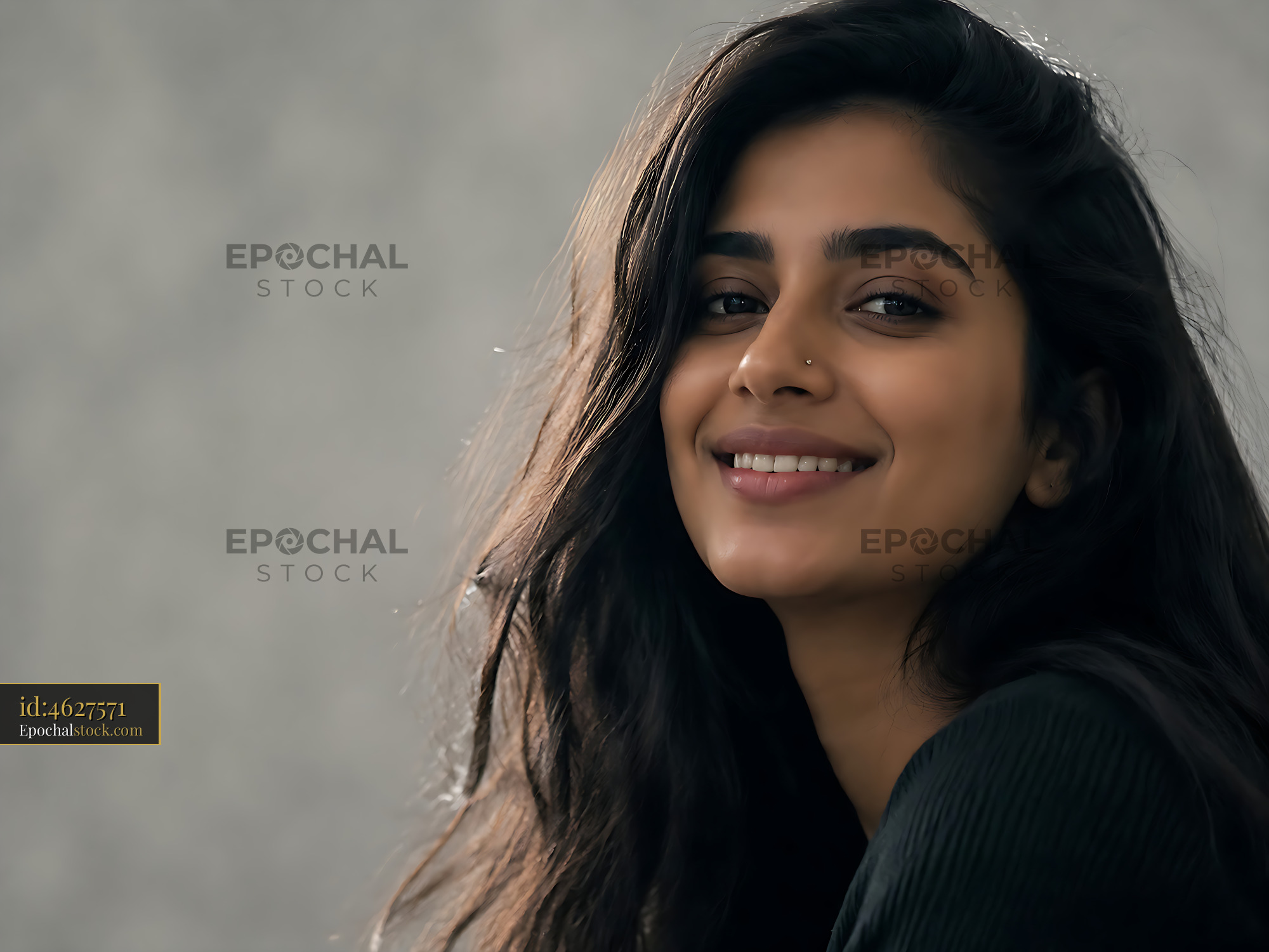 Watermarked full-resolution preview of Smiling woman with long hair in casual setting