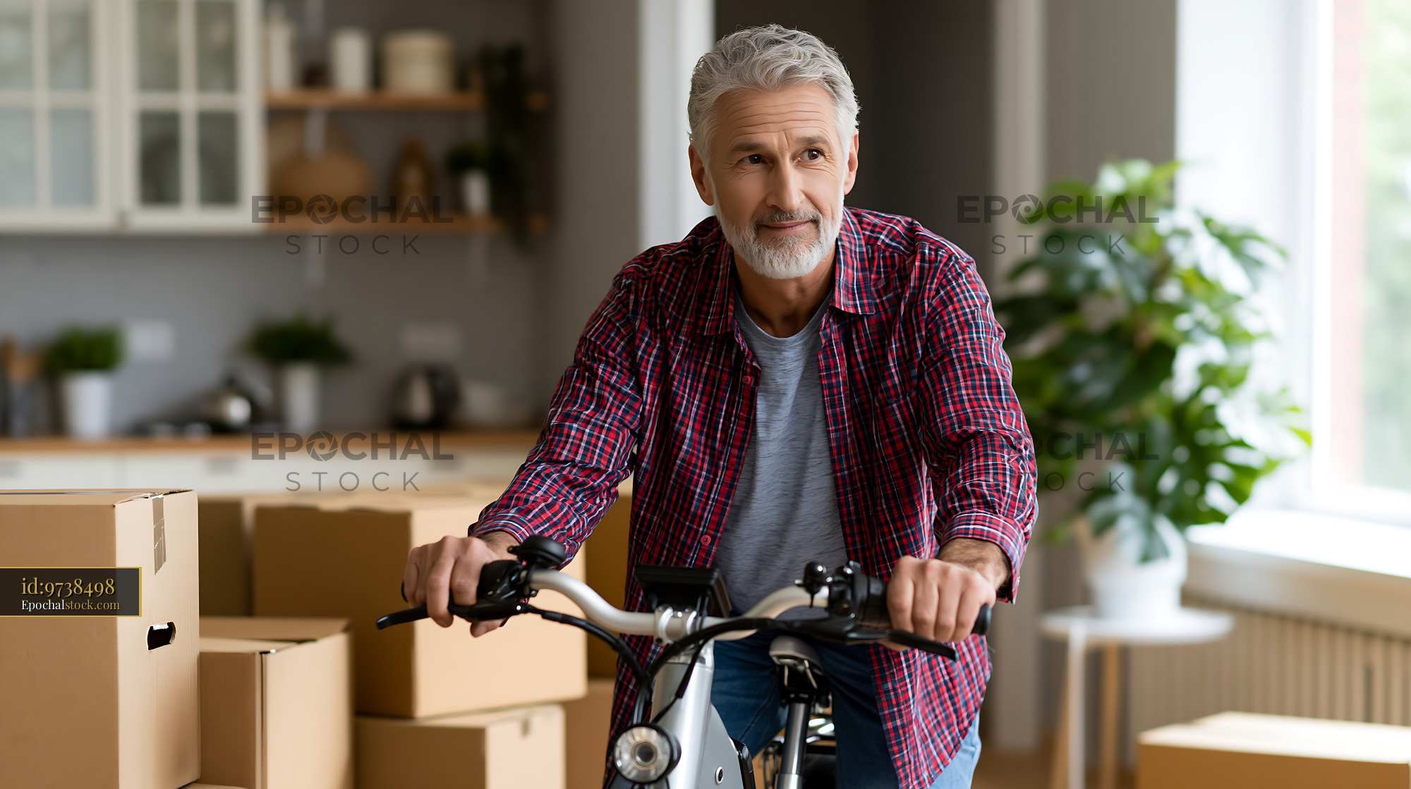 Watermarked full-resolution preview of Man rides bicycle in new home with moving boxes around him