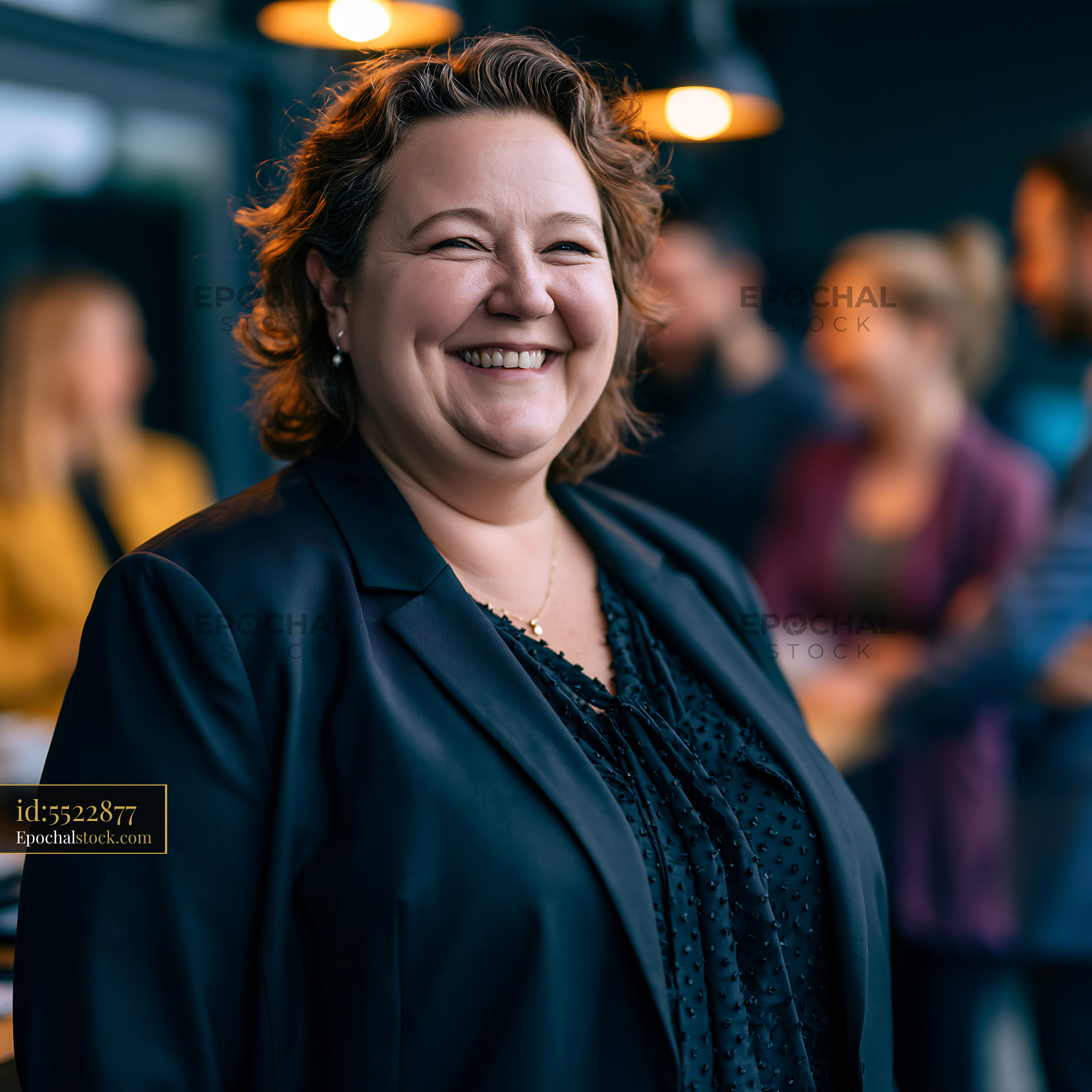 Watermarked full-resolution preview of Woman smiling in a business setting with colleagues in background