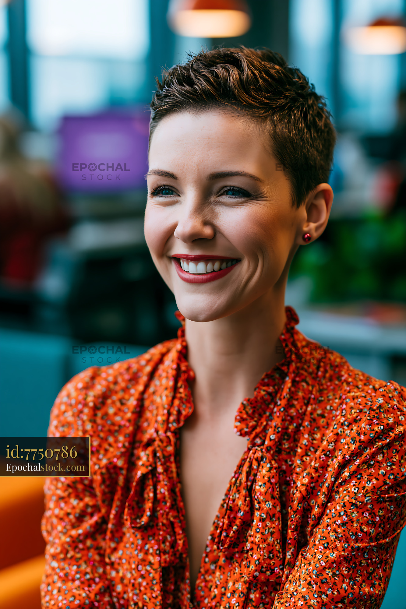 Watermarked full-resolution preview of Woman smiling in a modern workspace with colorful furniture
