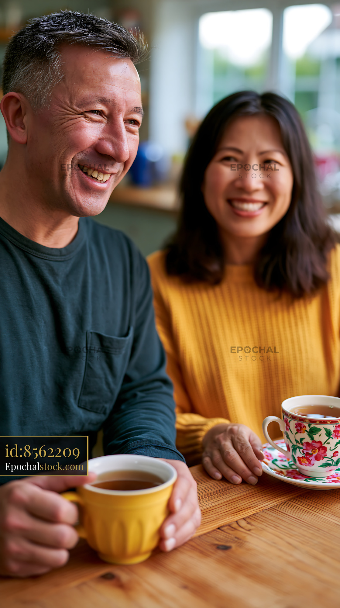 Watermarked full-resolution preview of Smiling couple enjoying coffee at a cozy cafe