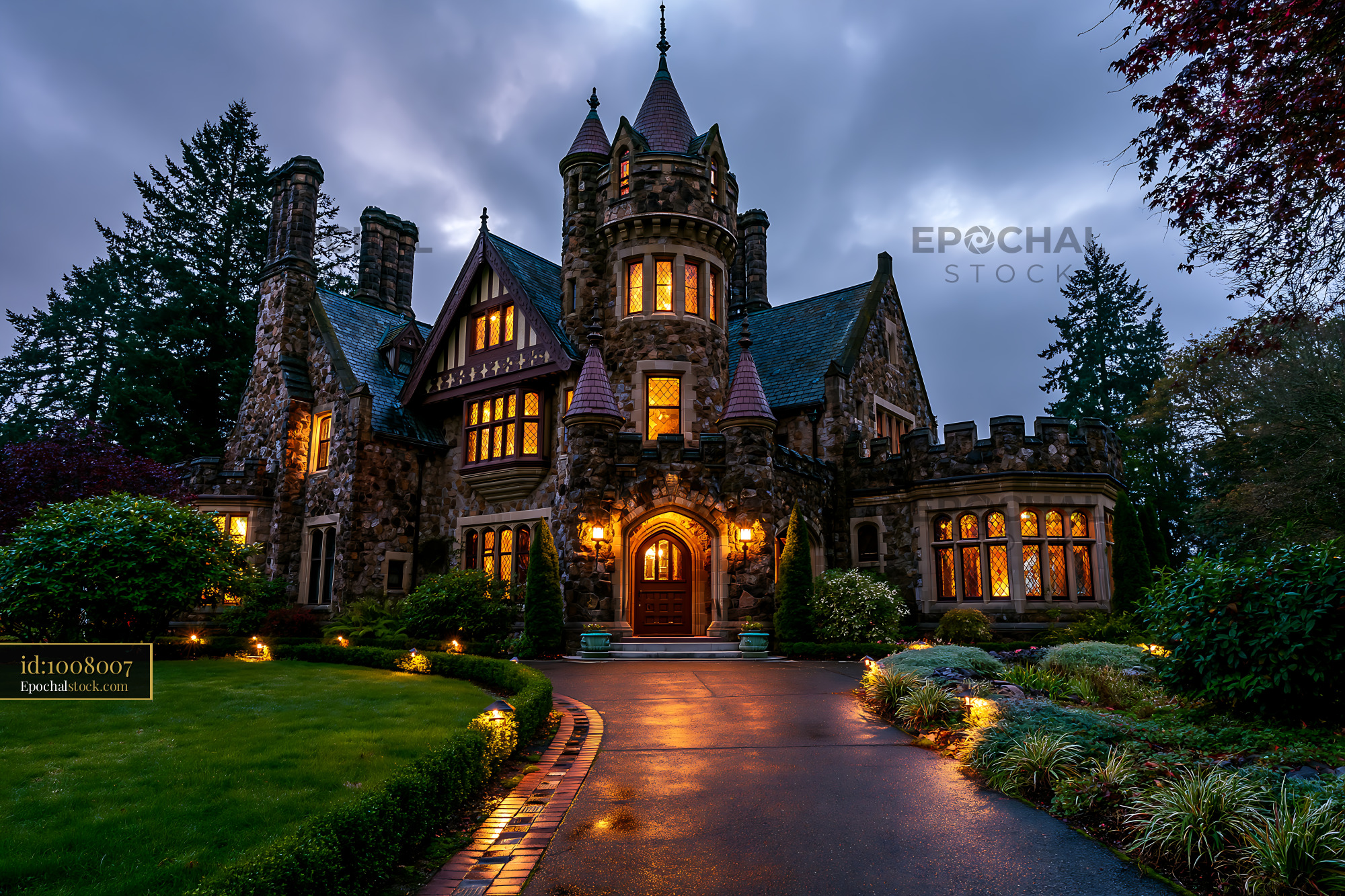 Watermarked full-resolution preview of Historic castle with illuminated windows on a cloudy evening