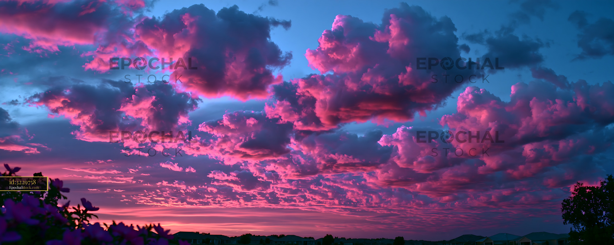 Watermarked full-resolution preview of Colorful clouds above a landscape during sunset