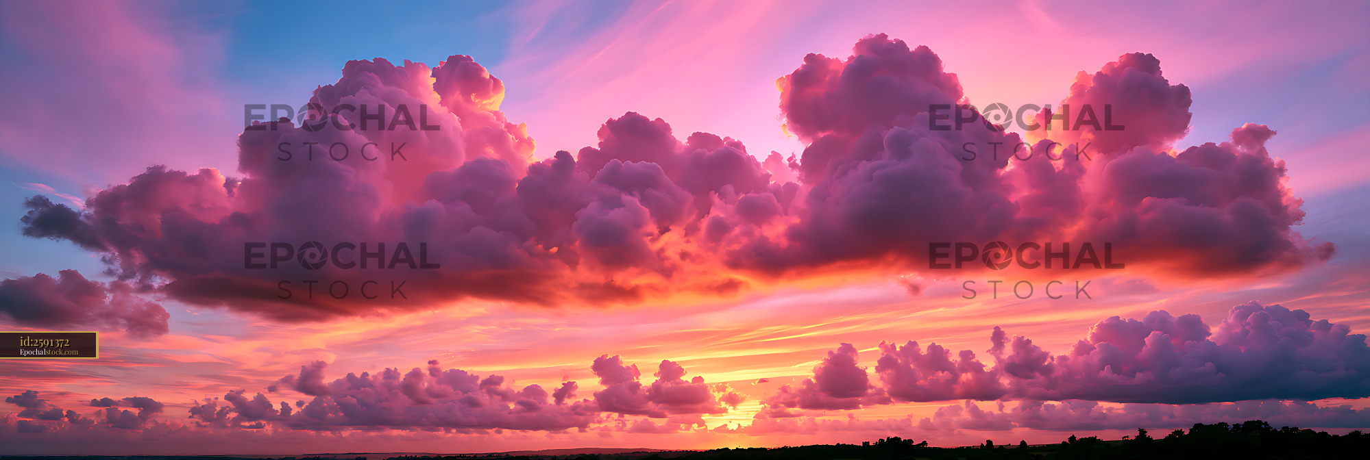 Watermarked full-resolution preview of Colorful sunset clouds over a distant horizon