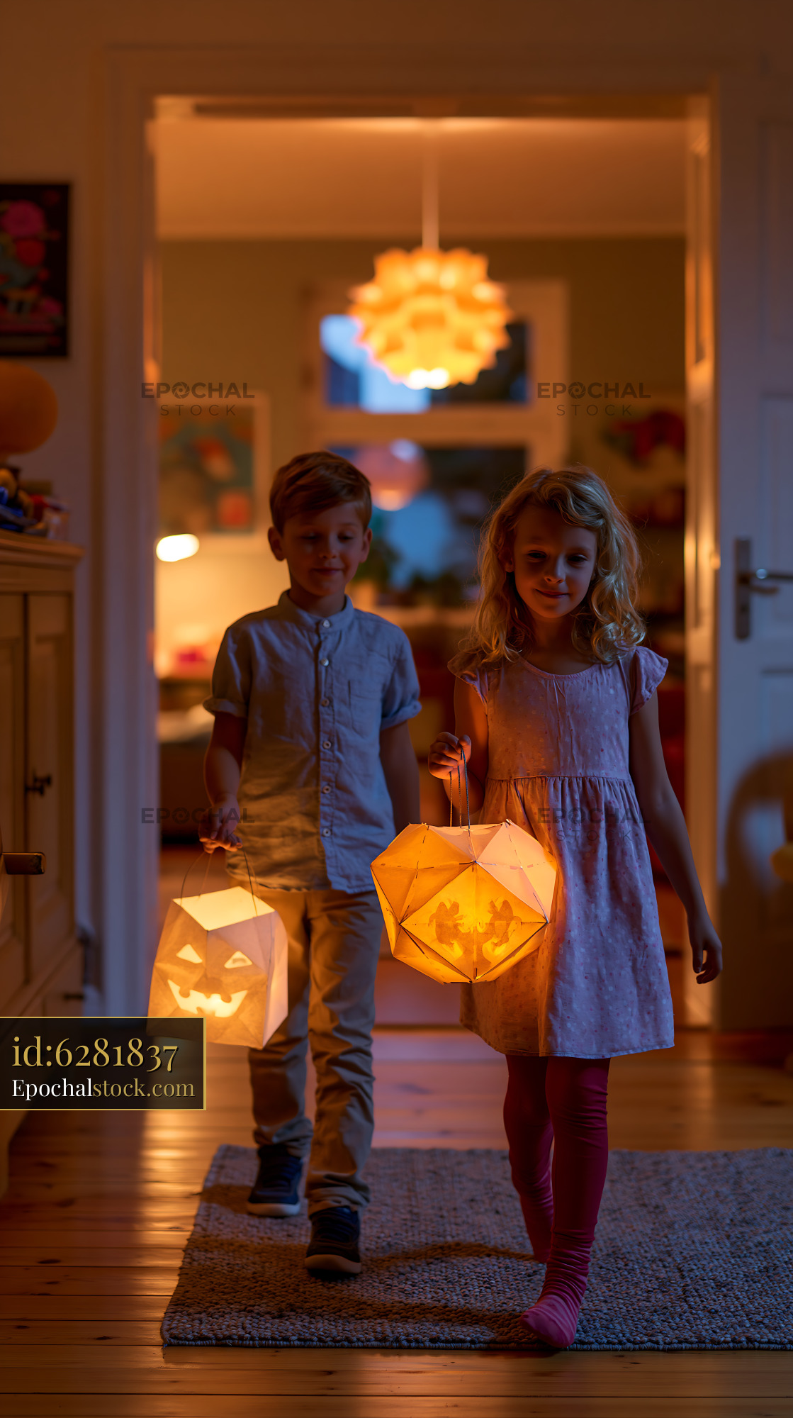 Watermarked full-resolution preview of Children carrying Halloween lanterns during evening walk