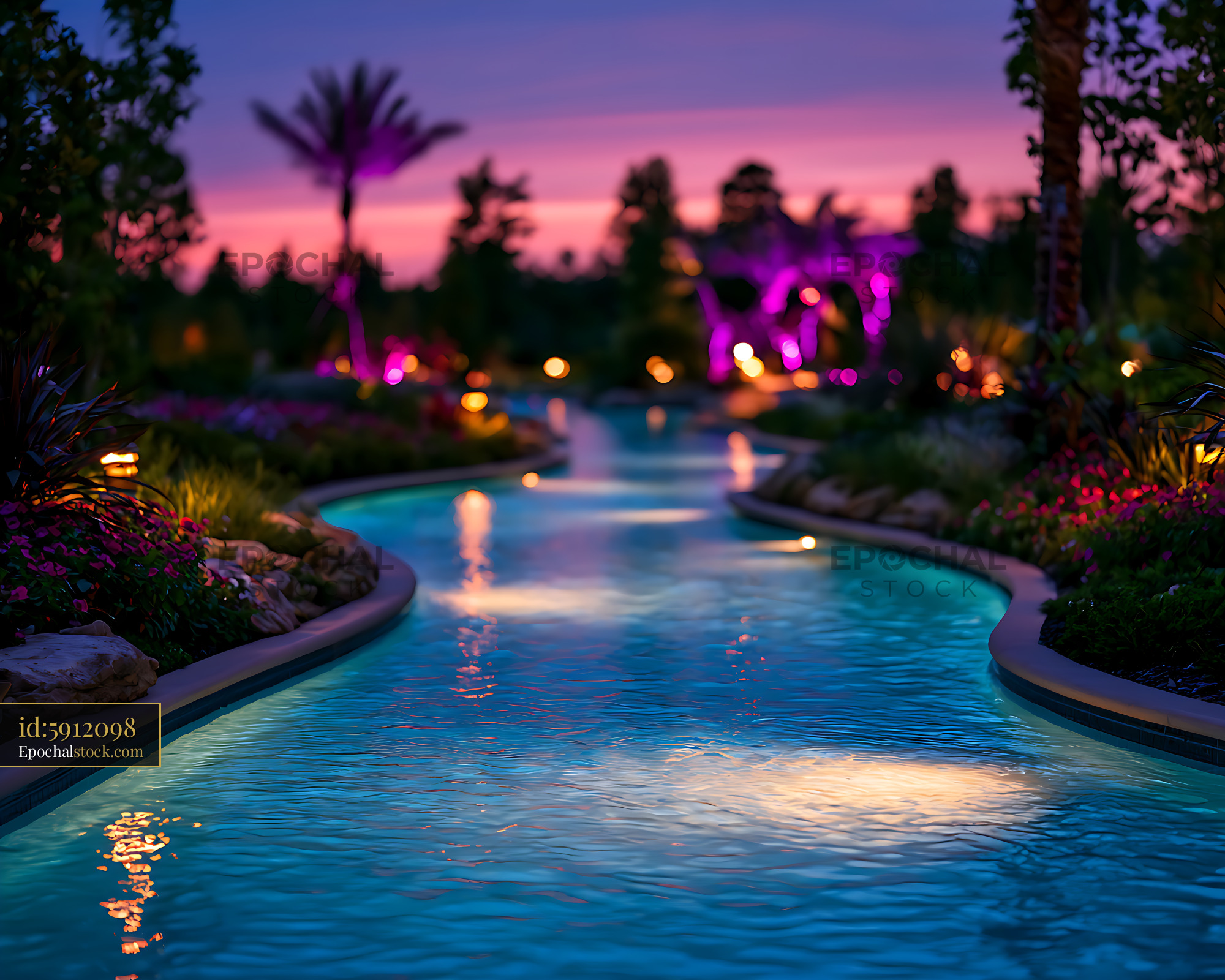 Watermarked full-resolution preview of Illuminated tropical swimming pool at sunset