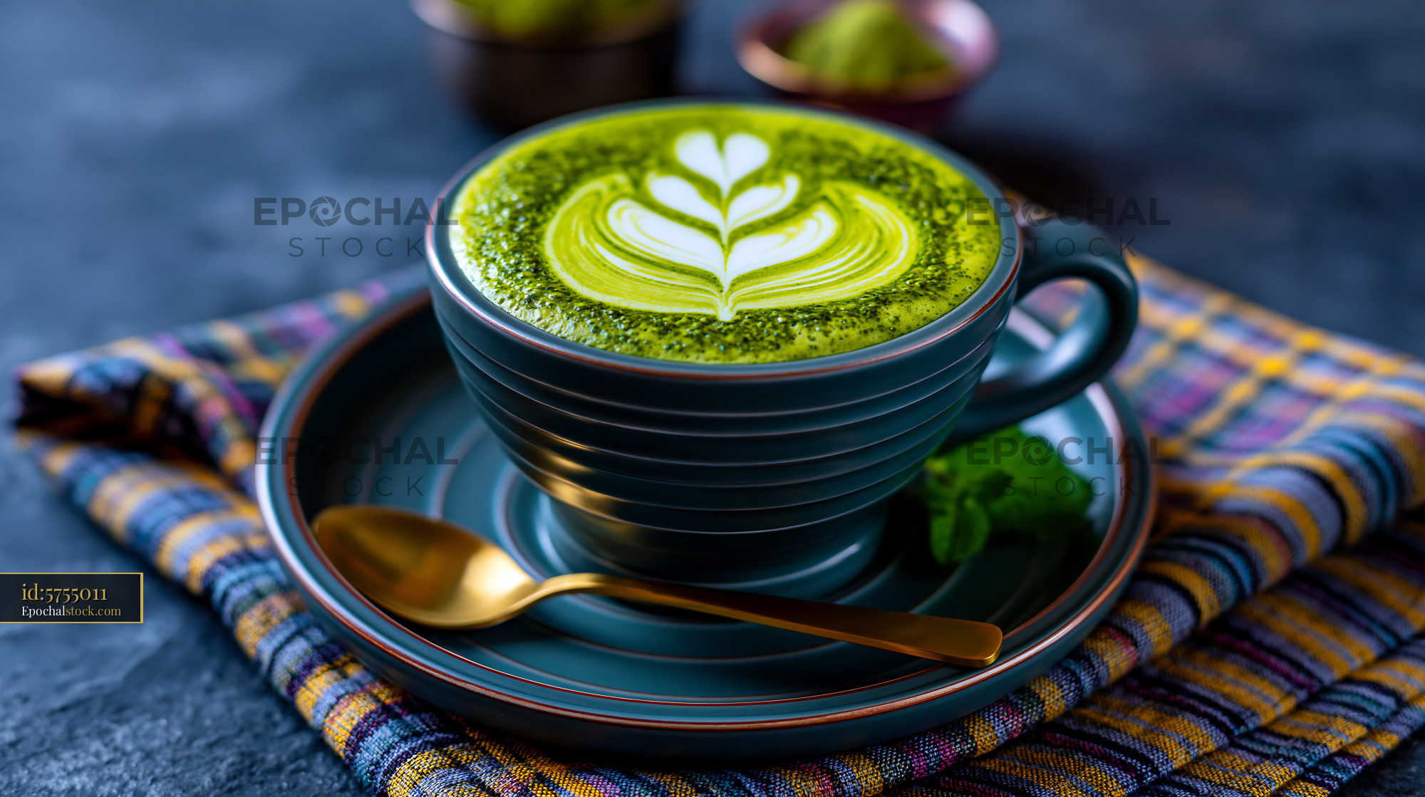 Watermarked full-resolution preview of Cup of matcha latte with leaf design on top