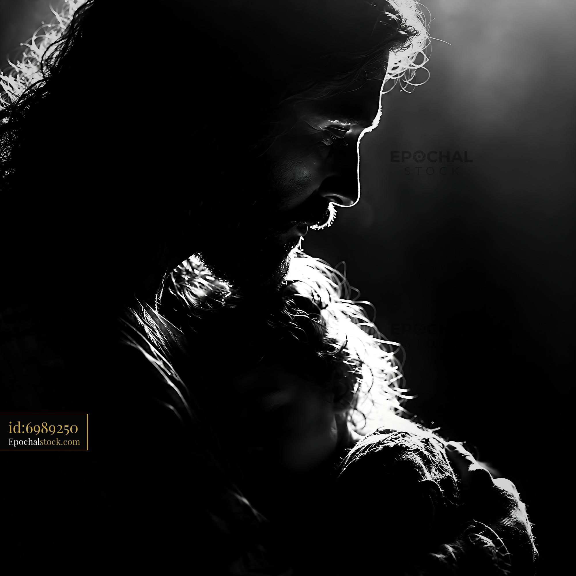 Watermarked full-resolution preview of Father holding child in silhouette