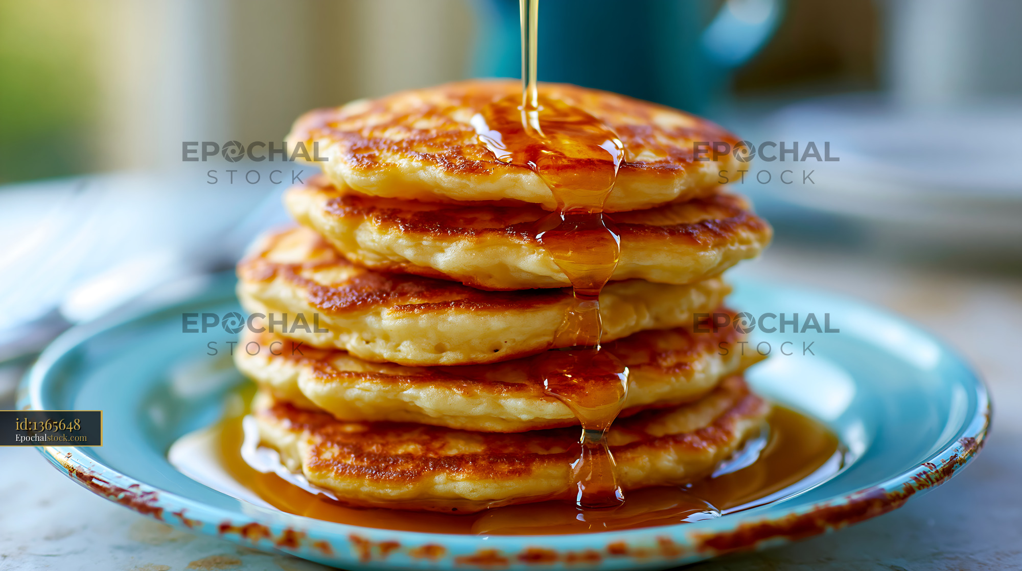 Watermarked full-resolution preview of Pancakes stacked on a blue plate with syrup pouring on top