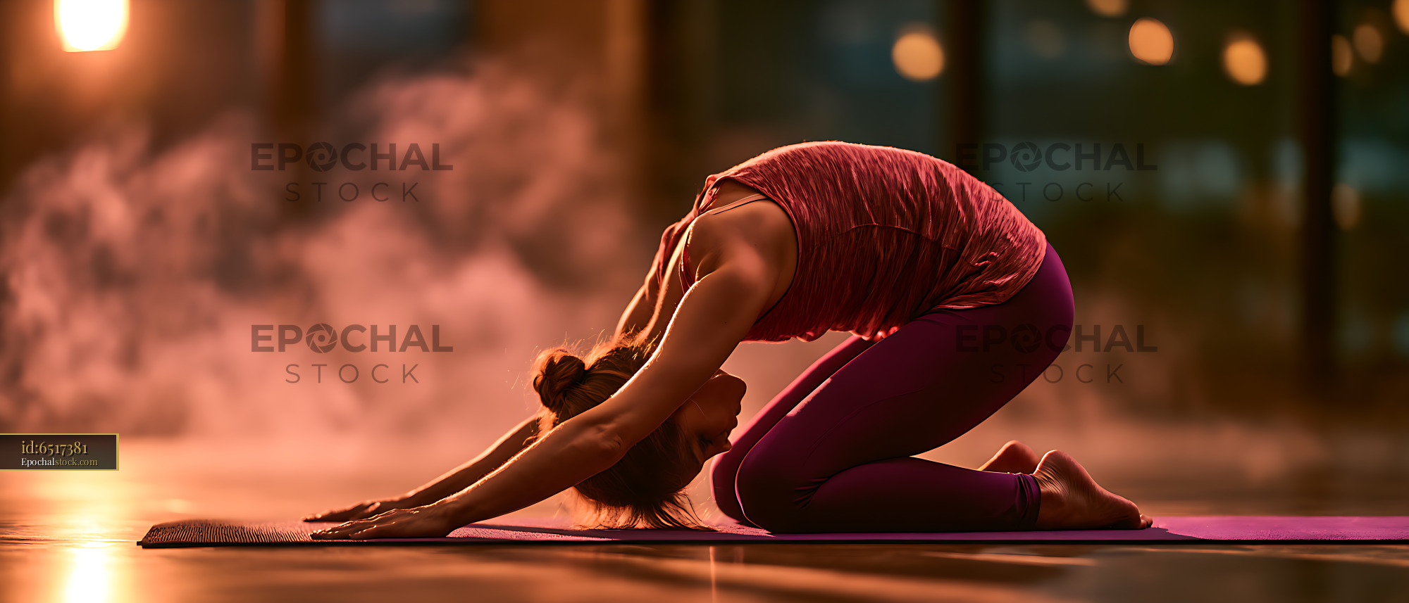 Watermarked full-resolution preview of Woman stretching in child's pose during yoga practice