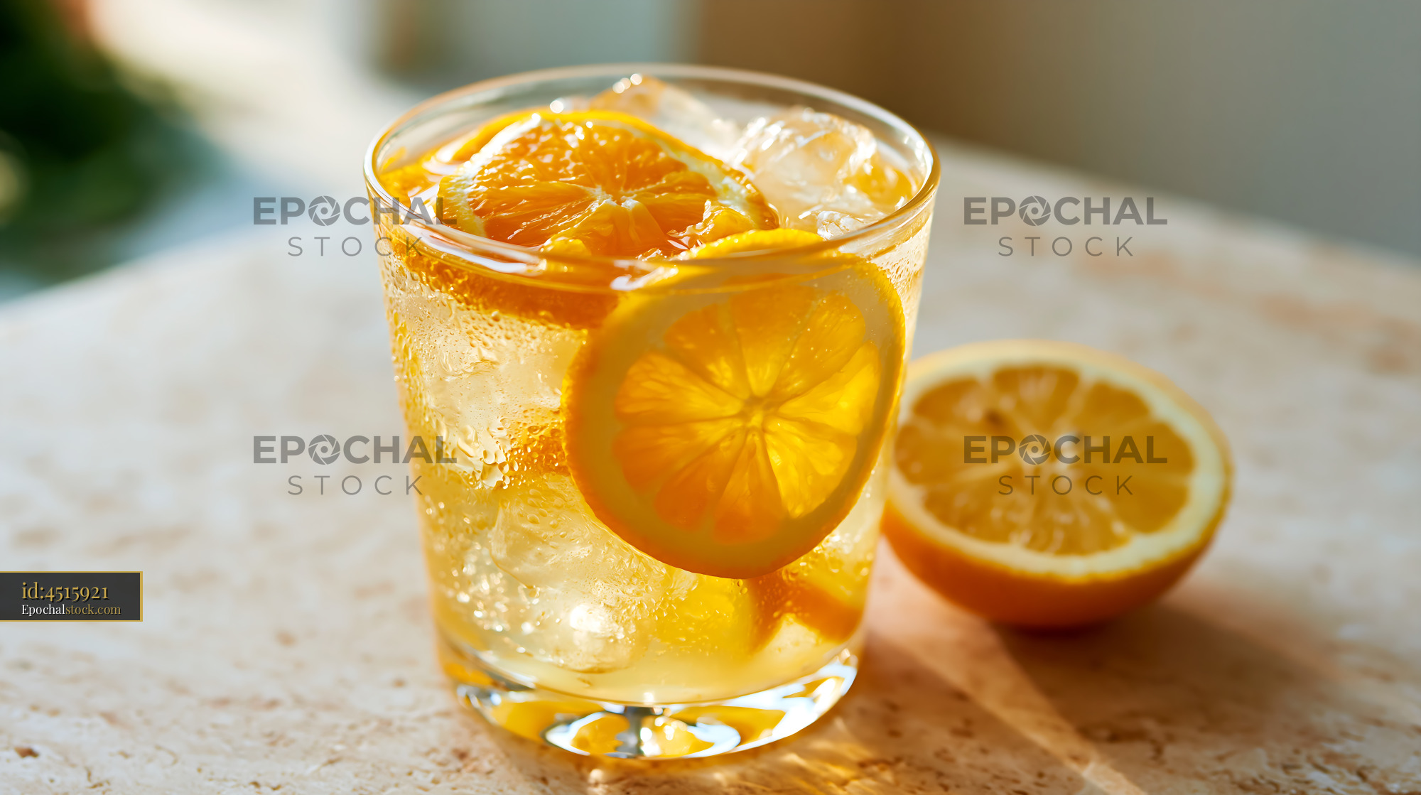 Watermarked full-resolution preview of Refreshing drink with lemon slices and ice in a glass