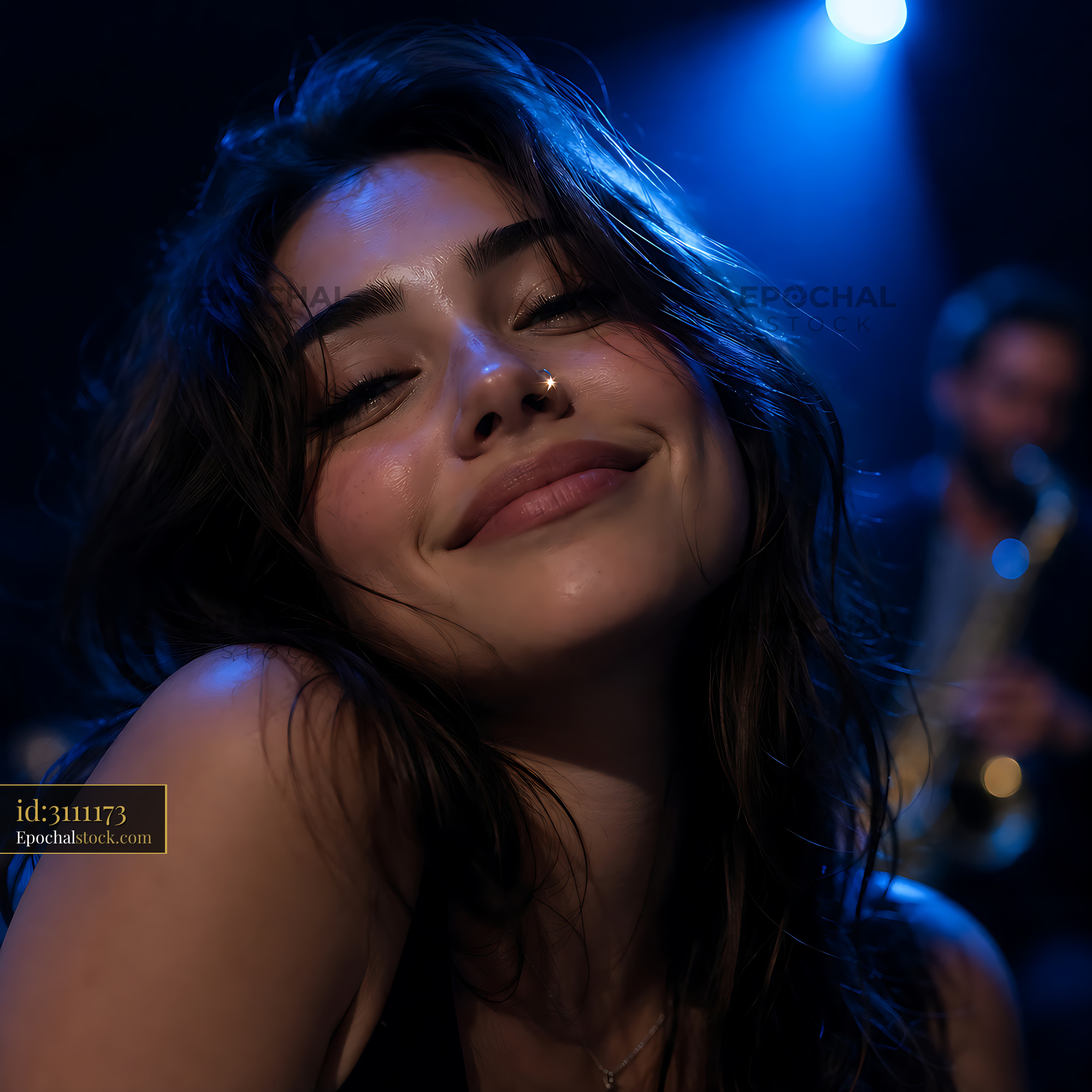 Watermarked full-resolution preview of Woman smiling in a dimly lit music venue with blue lights