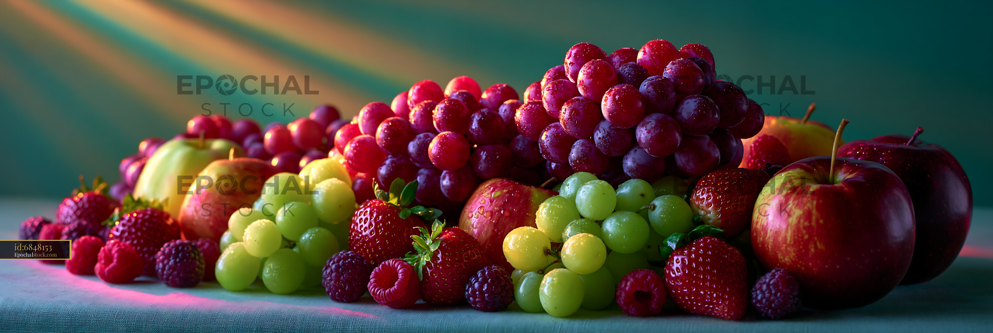 Watermarked full-resolution preview of Fresh fruits arranged on a table with sunlight shining