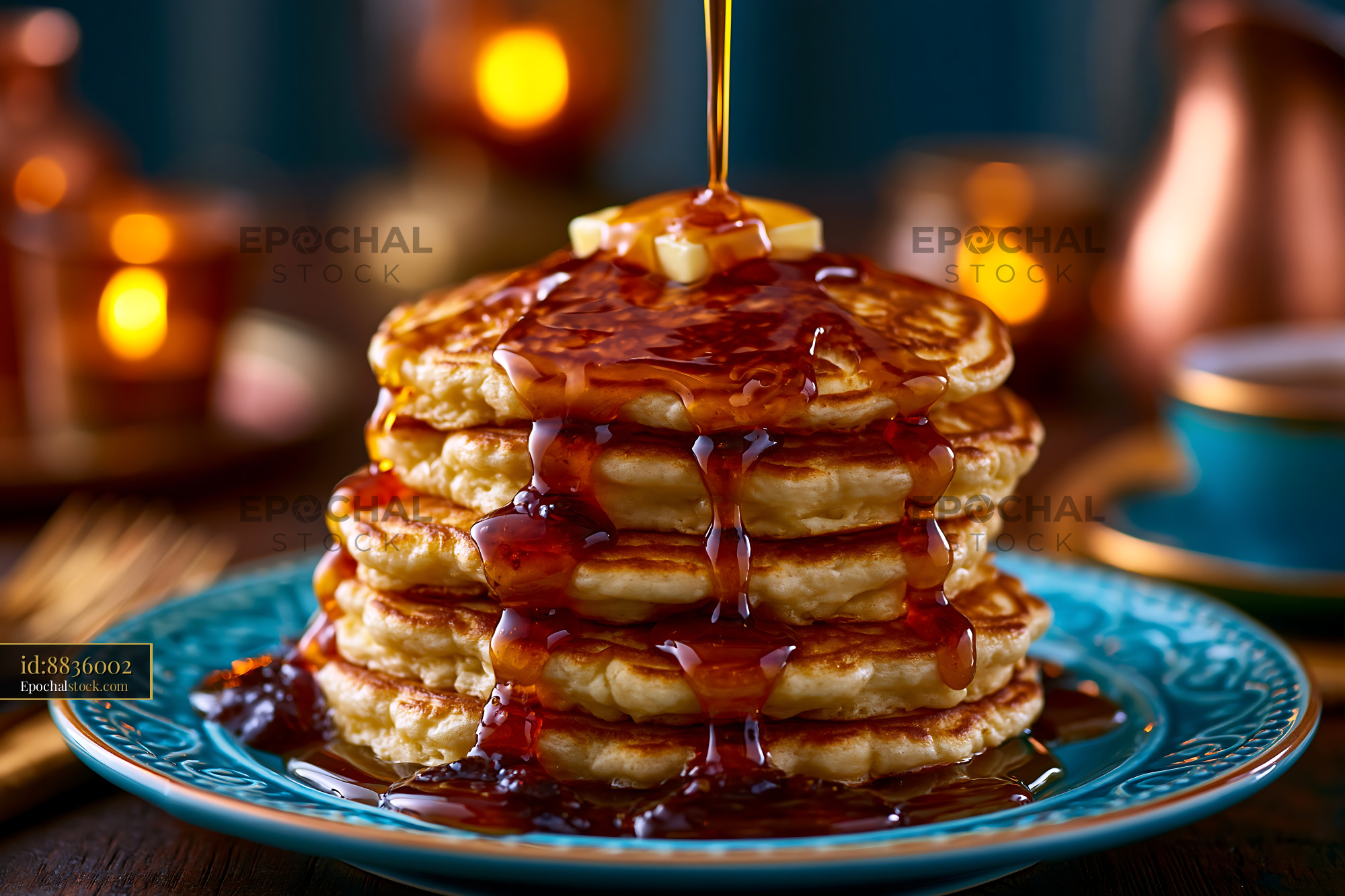 Watermarked full-resolution preview of Stack of pancakes with syrup and butter on a blue plate