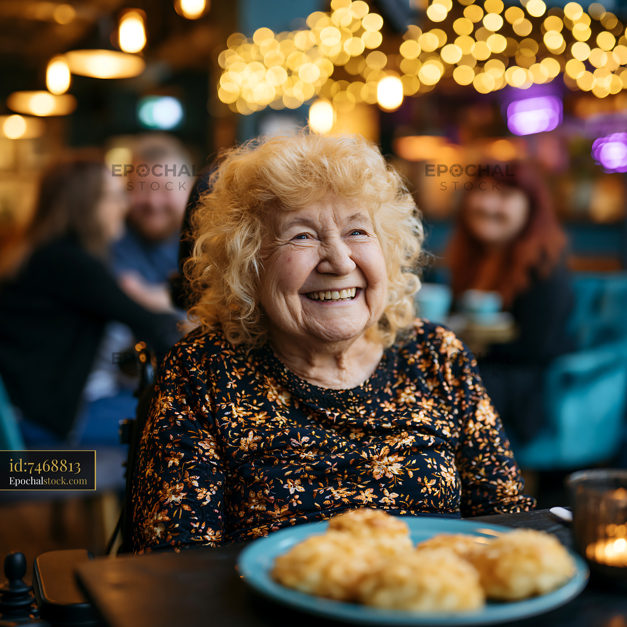 Watermarked full-resolution preview of Smiling elderly woman sitting in a cafe with food on the table