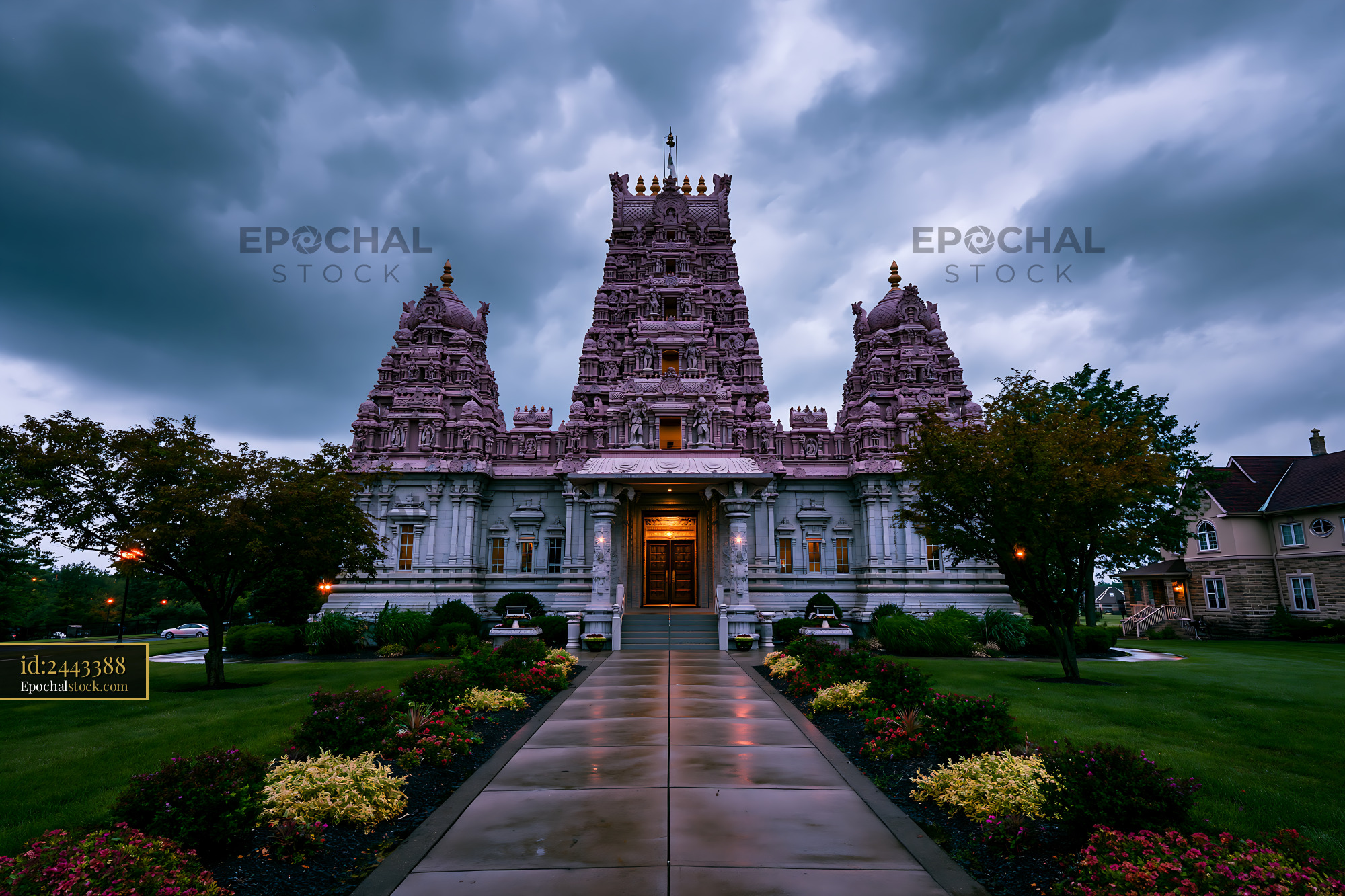 Watermarked full-resolution preview of Hindu temple stands tall under cloudy sky in evening light