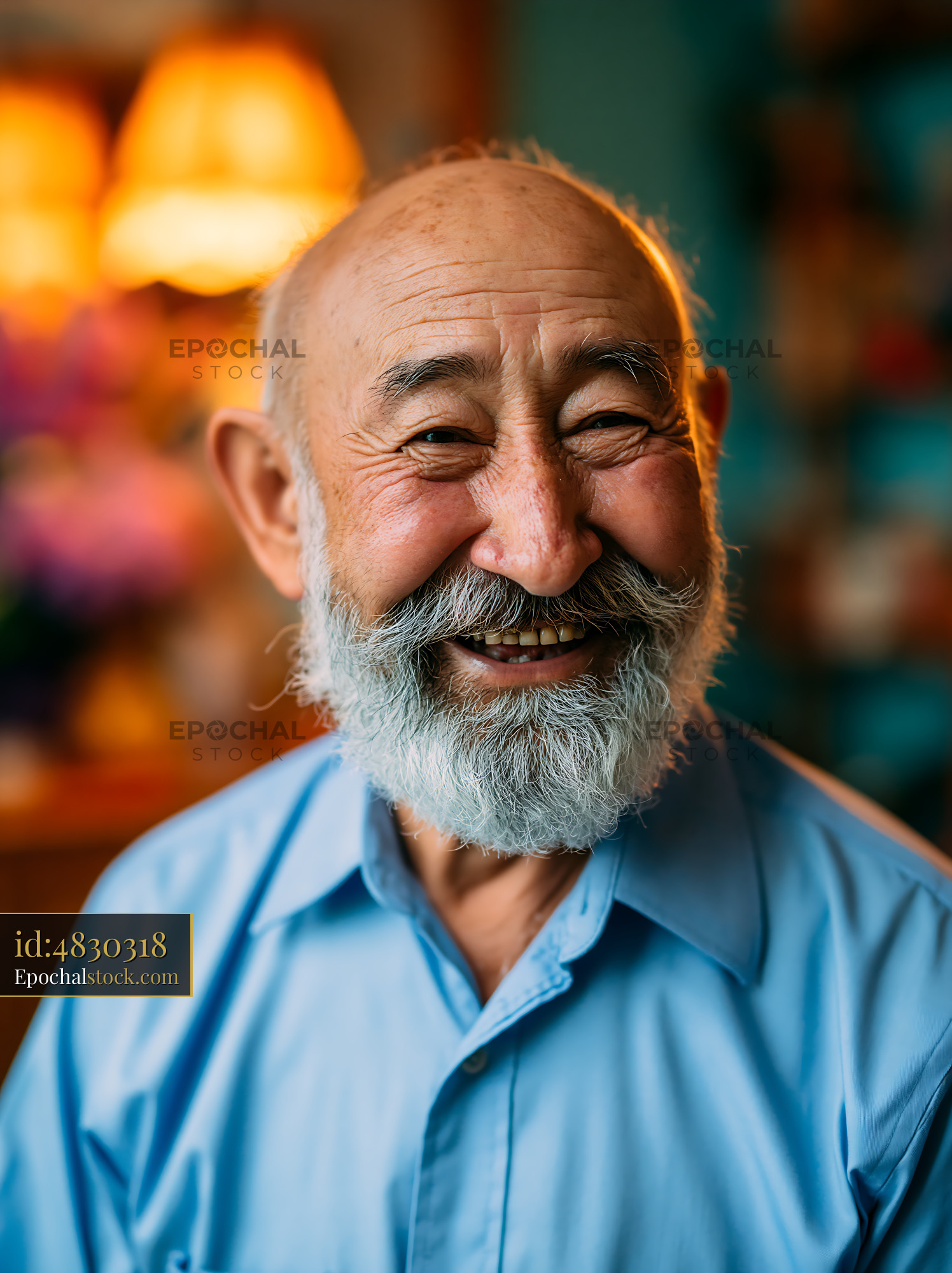 Watermarked full-resolution preview of Elderly man smiling warmly indoors with soft lighting