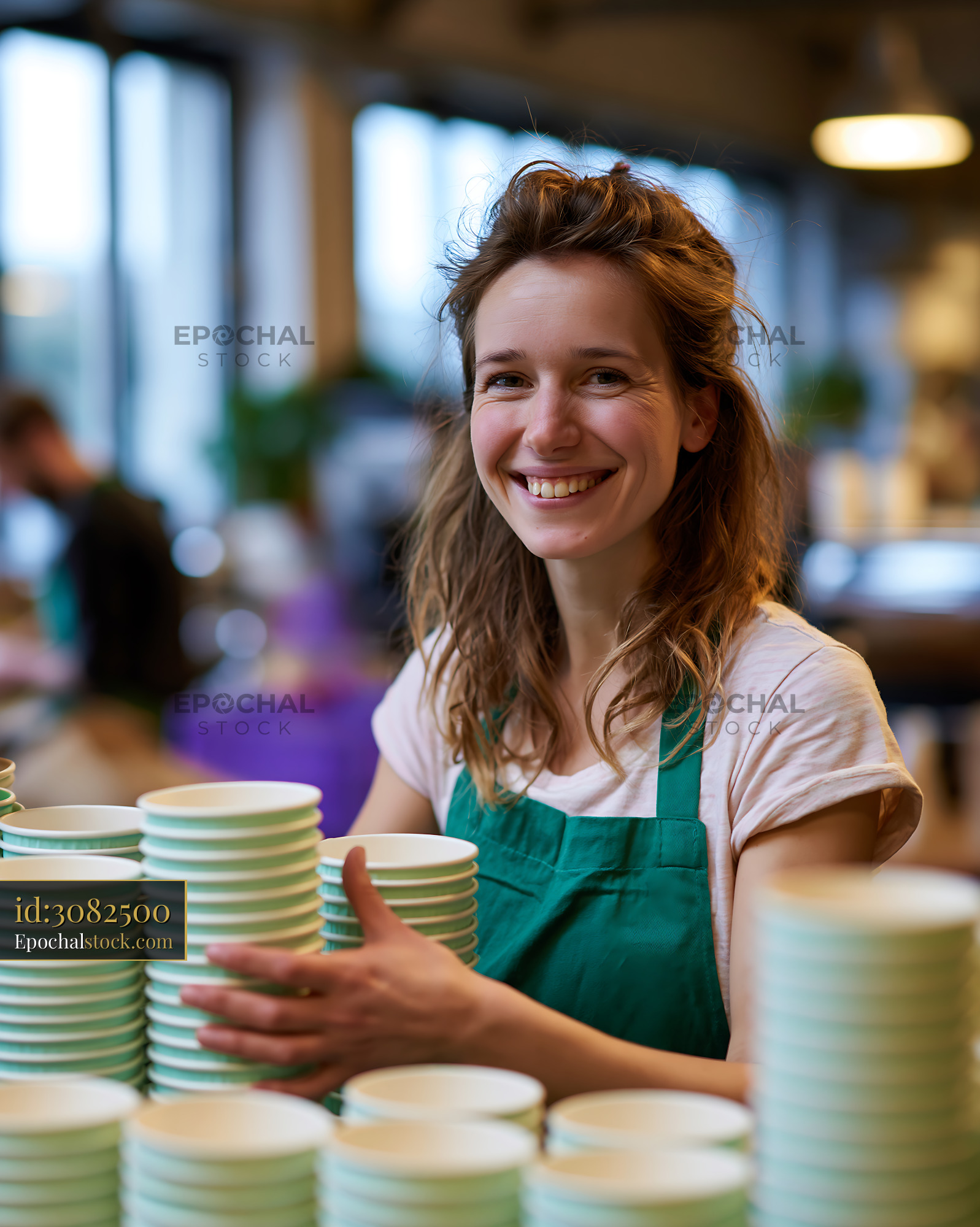 Watermarked full-resolution preview of Barista stacking cups in a busy coffee shop