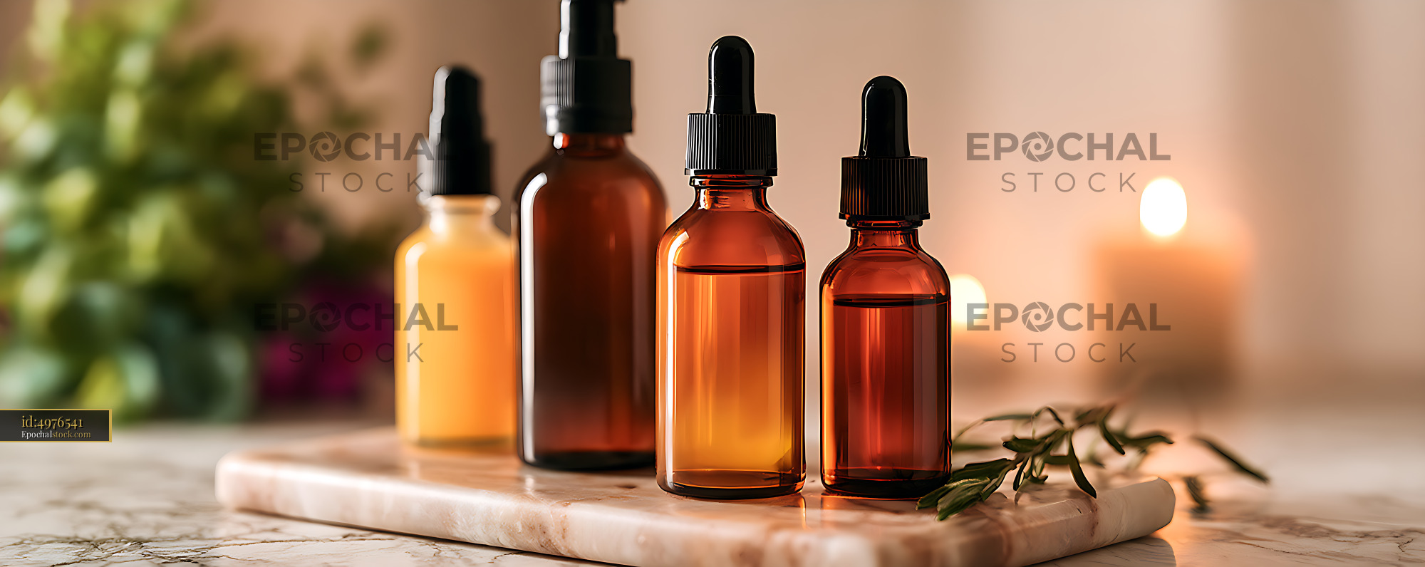 Watermarked full-resolution preview of Amber glass dropper bottles in warm natural light