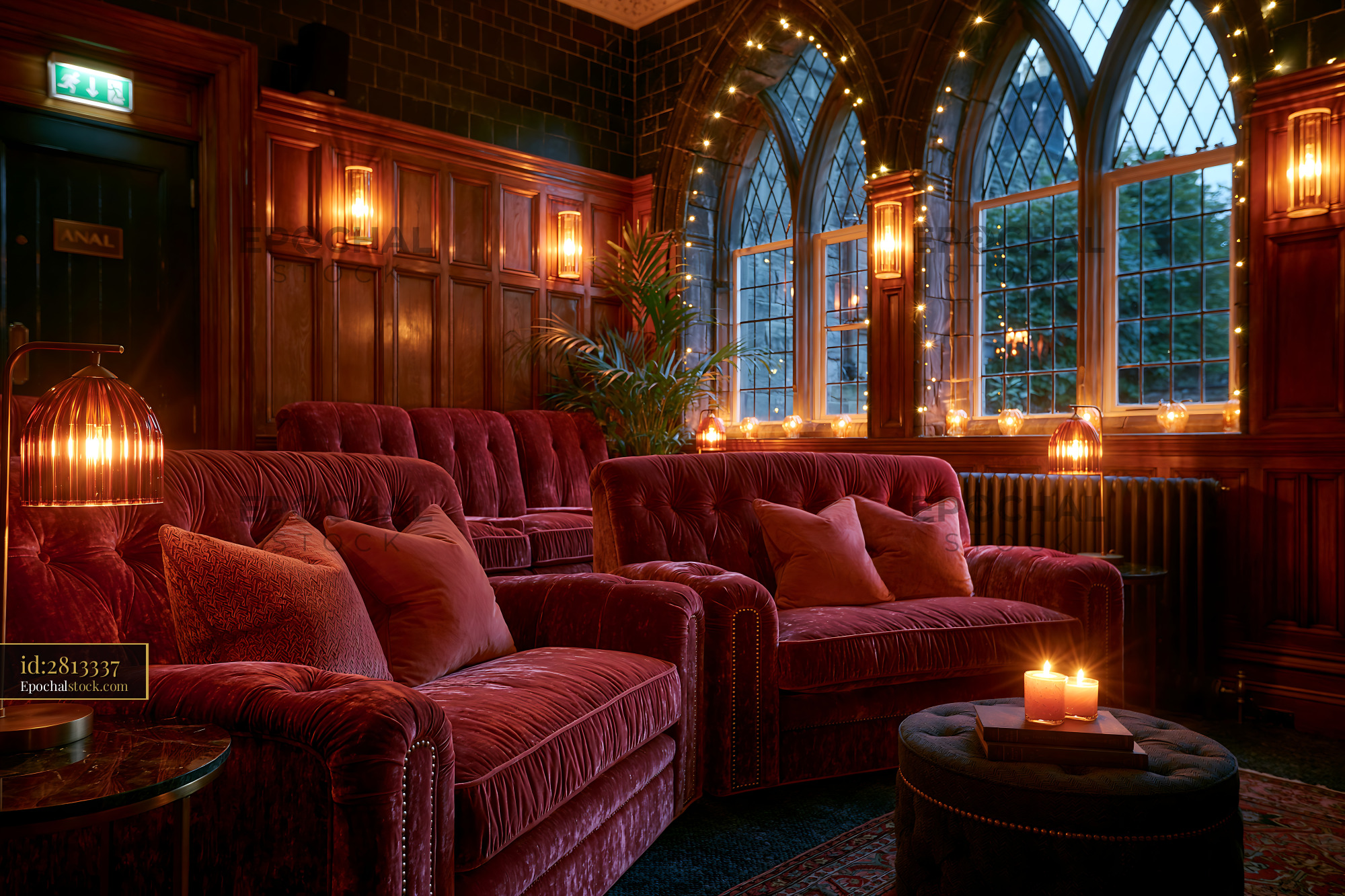Watermarked full-resolution preview of Cozy seating area with warm lighting and large windows