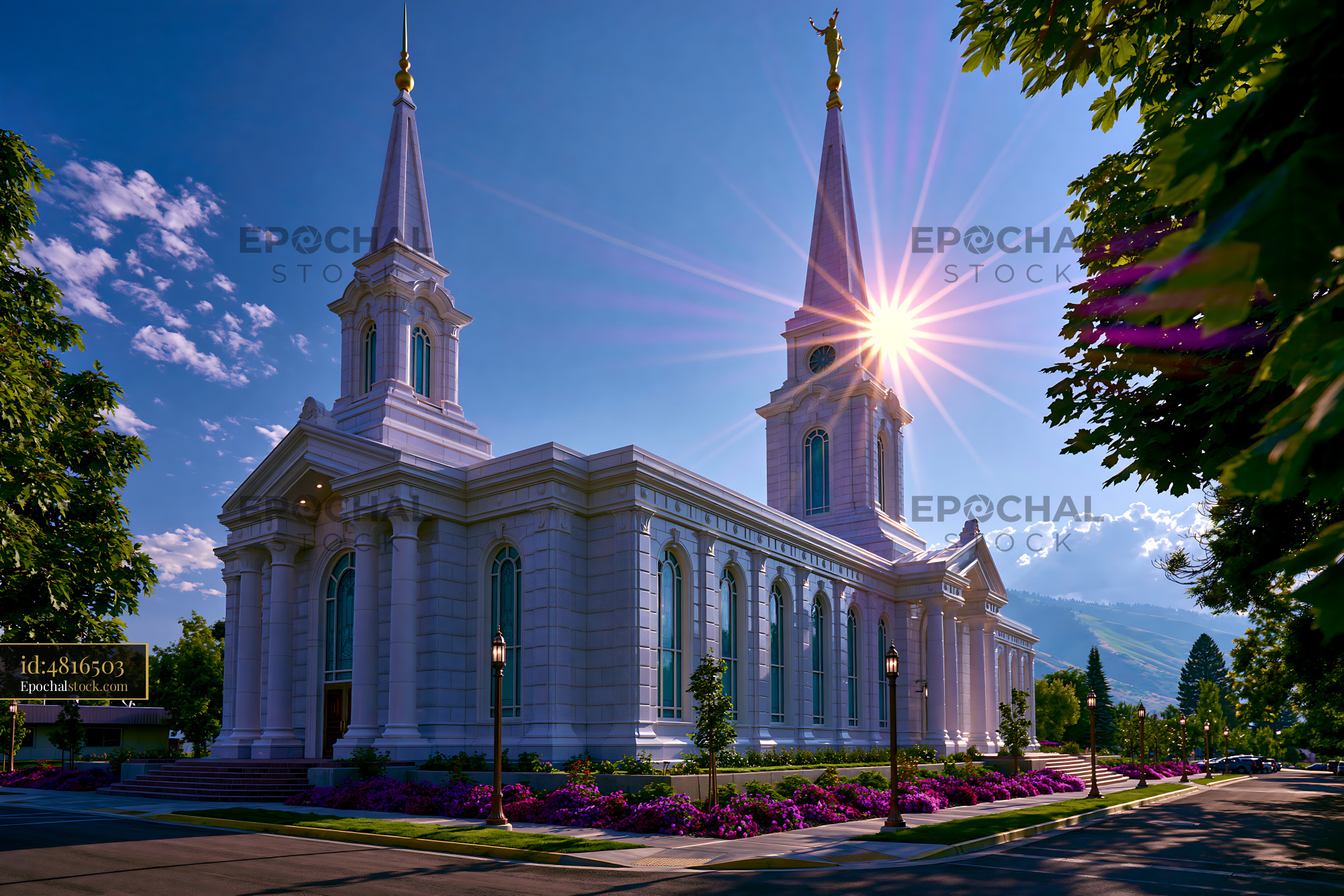 Watermarked full-resolution preview of Sunlight shines on a white church building with tall spires