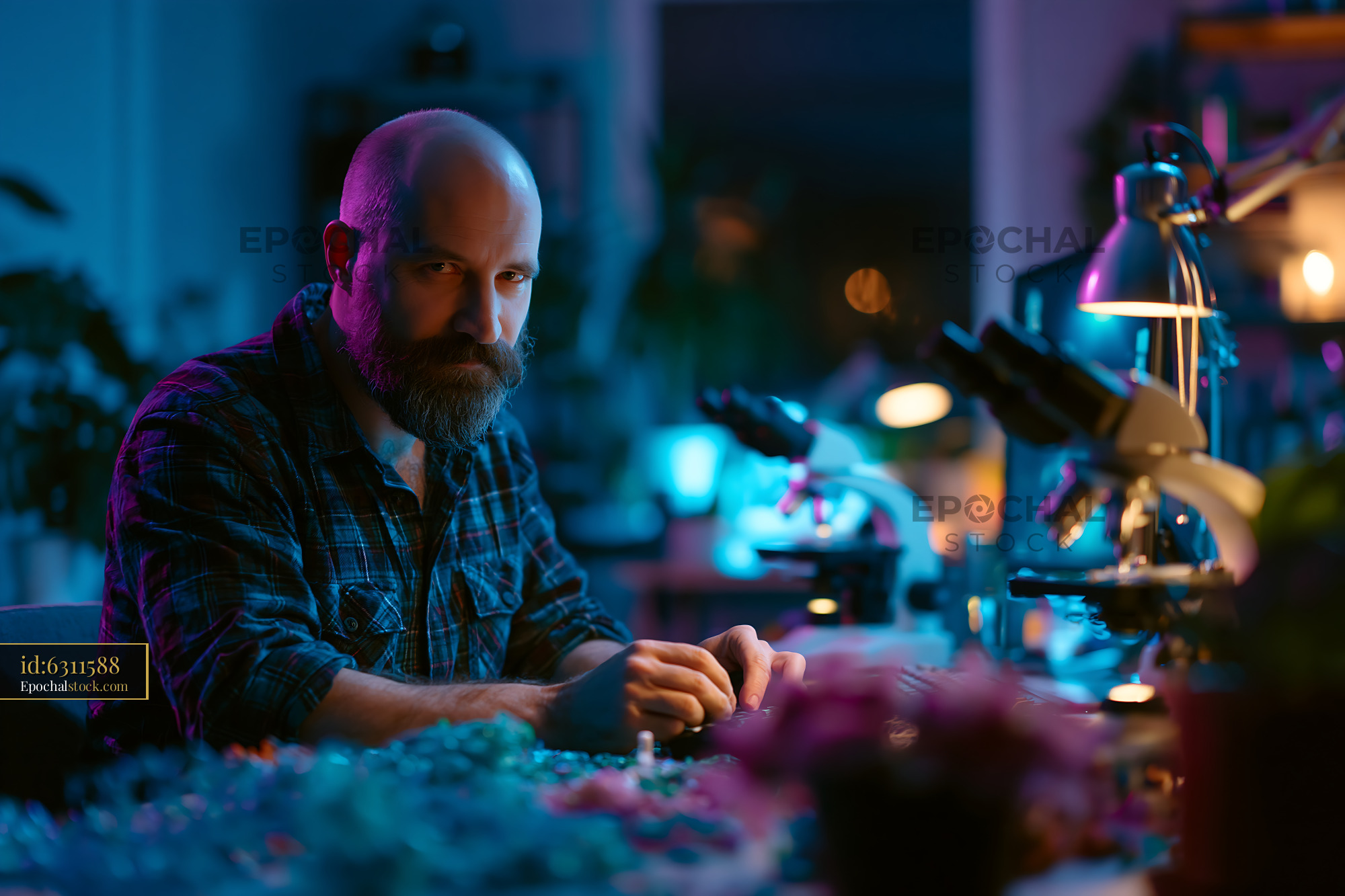 Watermarked full-resolution preview of Man working in a laboratory surrounded by scientific equipment