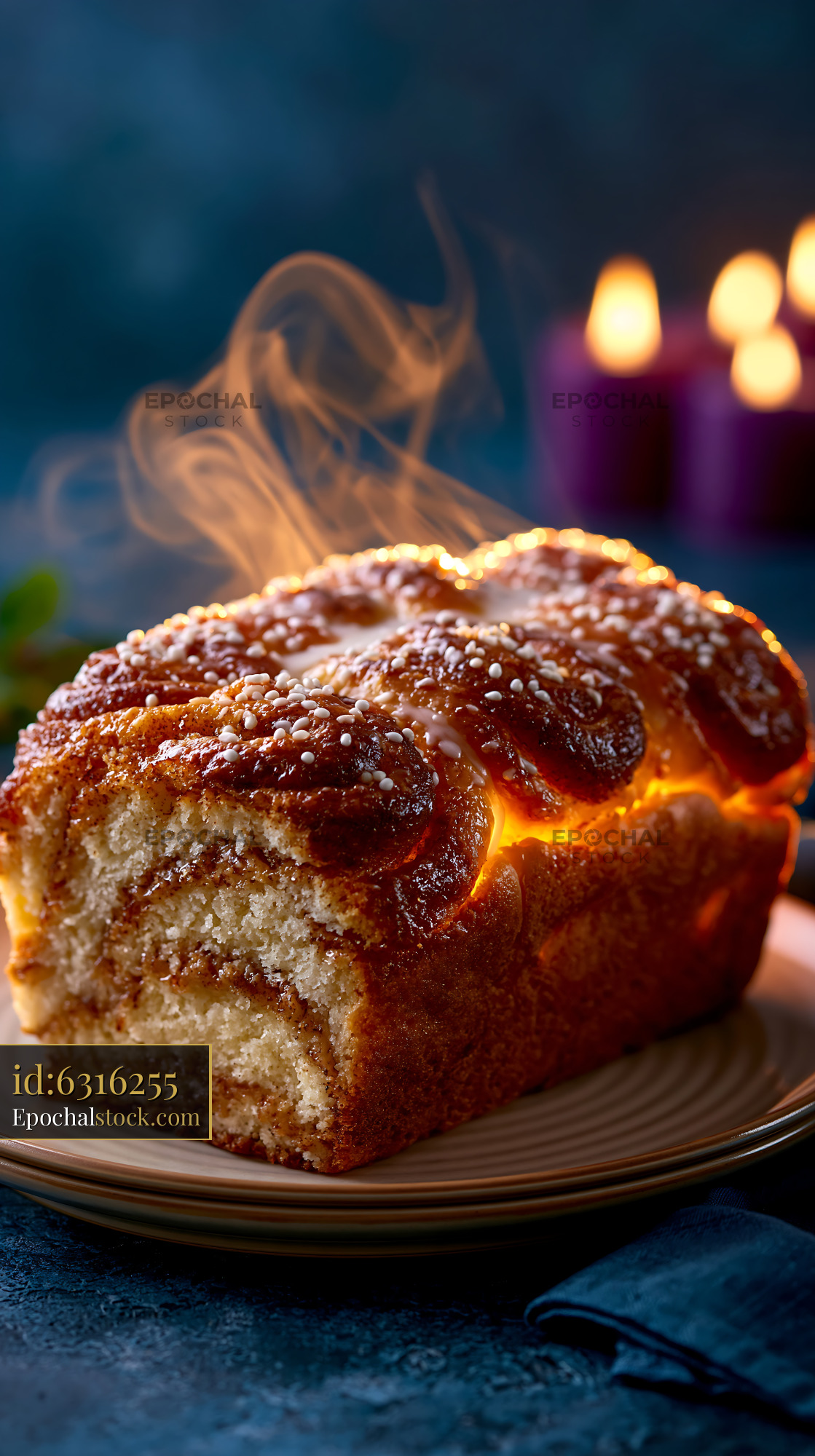 Watermarked full-resolution preview of Freshly baked bread with steam rising on a plate