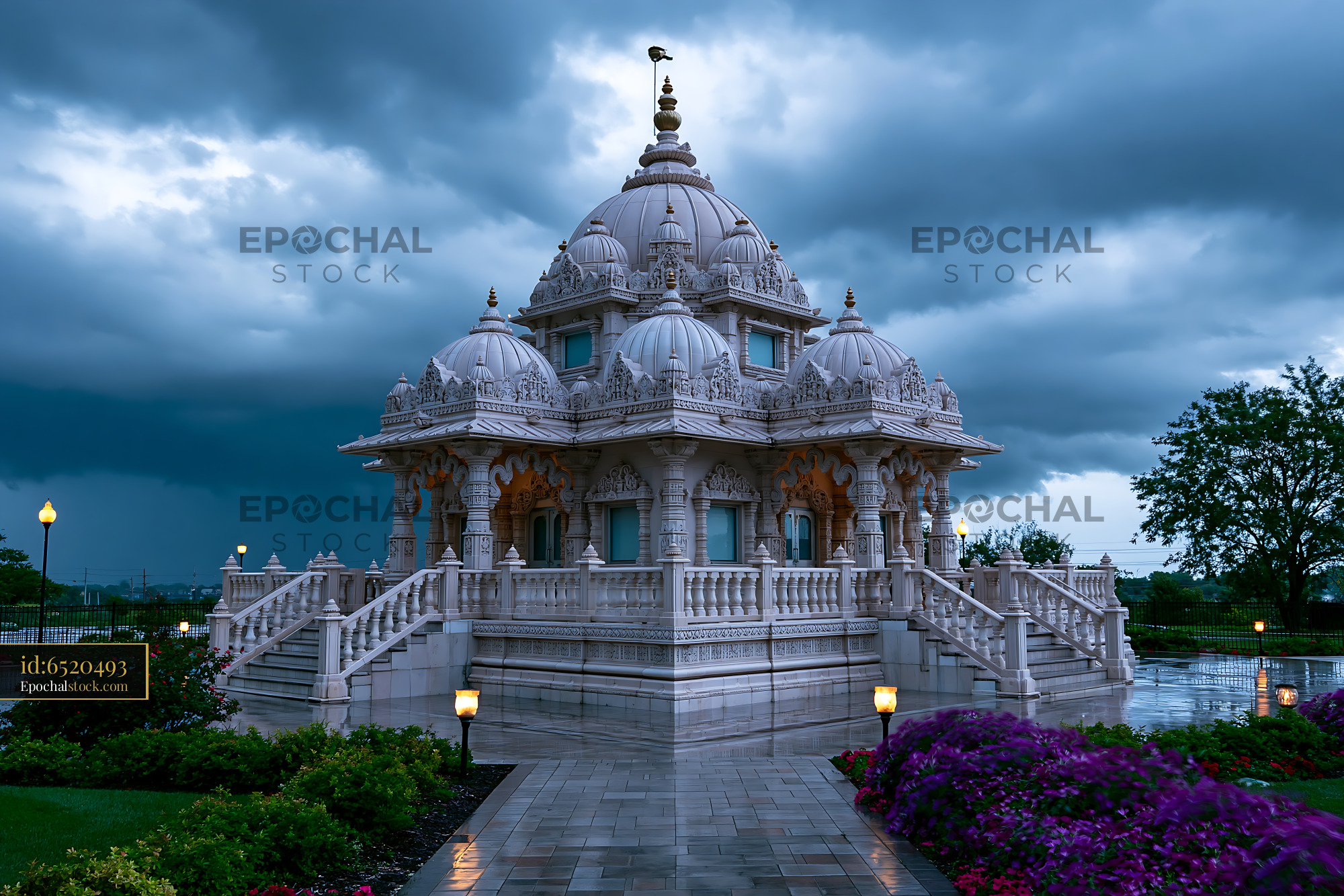 Watermarked full-resolution preview of Hindu temple structure under a cloudy sky with rain