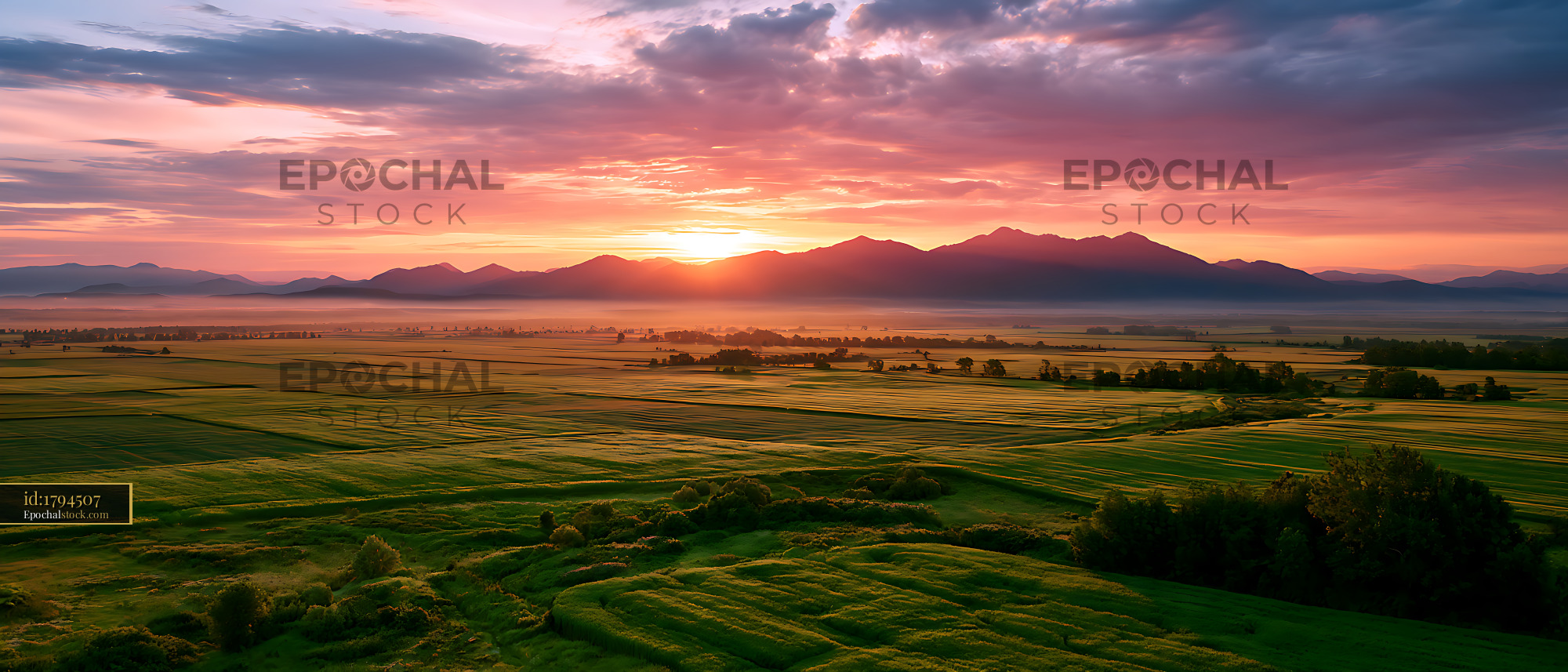 Watermarked full-resolution preview of Colorful sunset above farmland and distant mountains