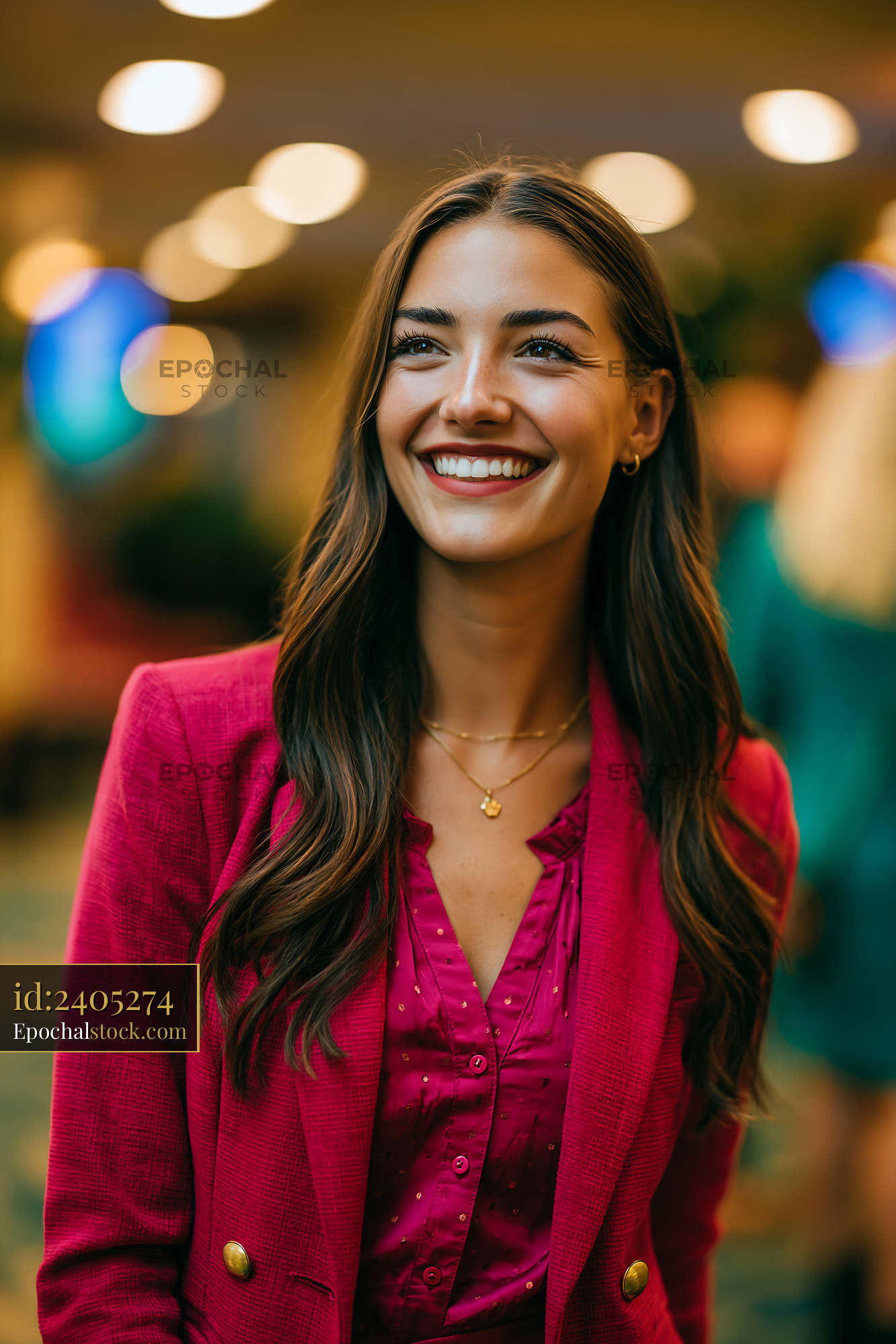 Watermarked full-resolution preview of Smiling woman wearing pink outfit in indoor setting