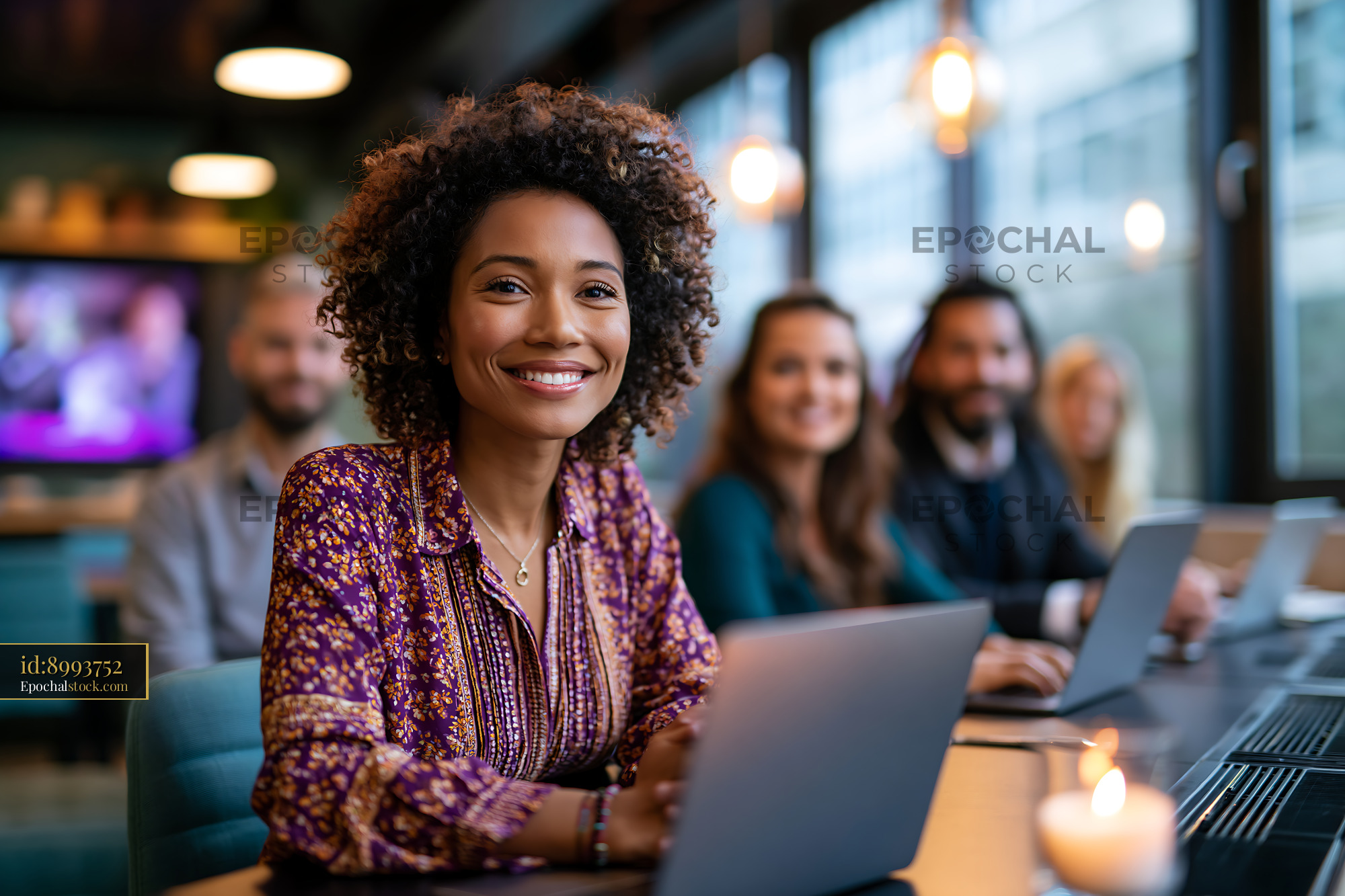 Diverse Hybrid Team Working Together in a Modern Office Setting - stock photo