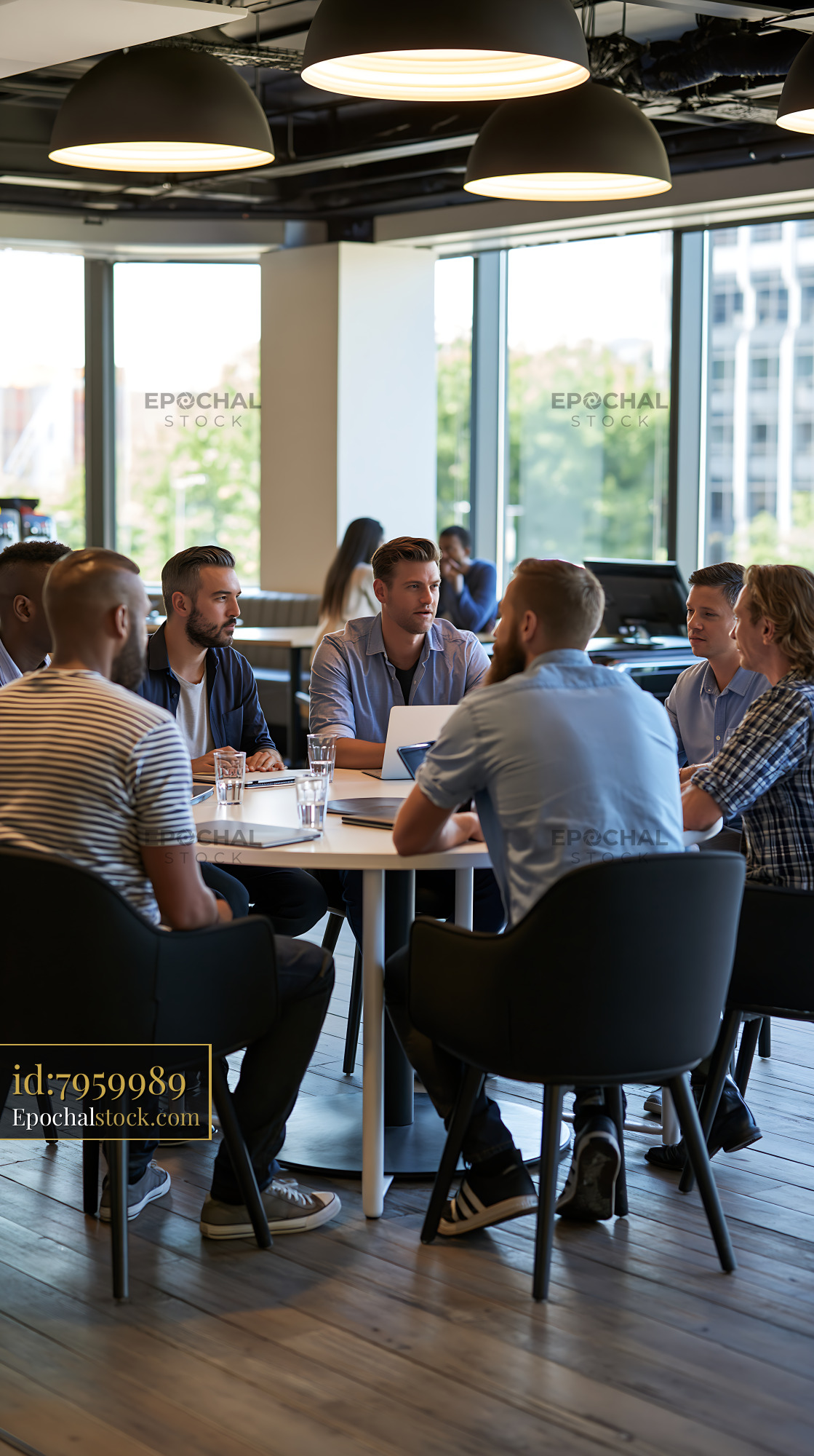 Watermarked full-resolution preview of Business team meeting in modern office space