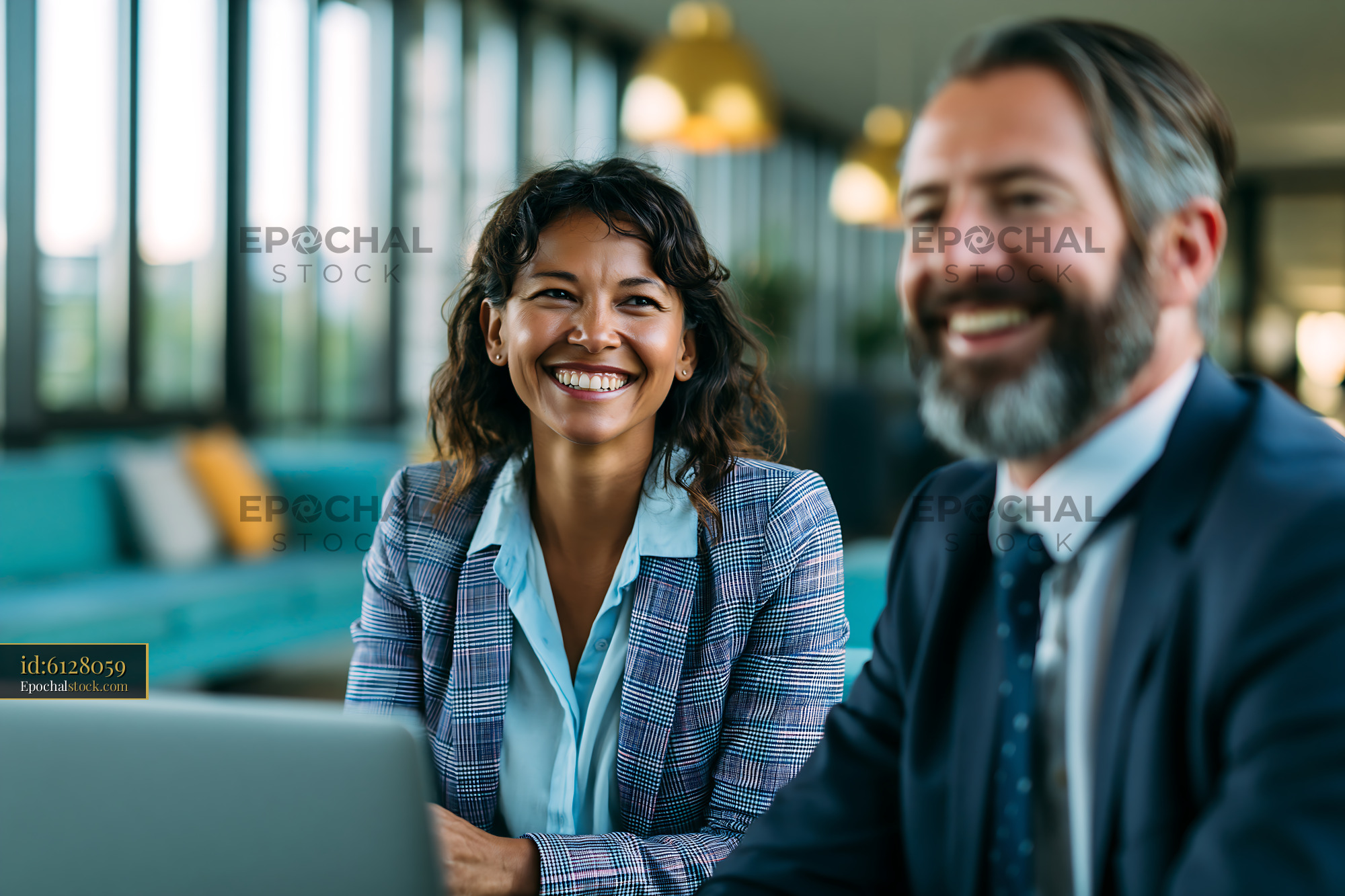 Watermarked full-resolution preview of Business people working together in a modern office