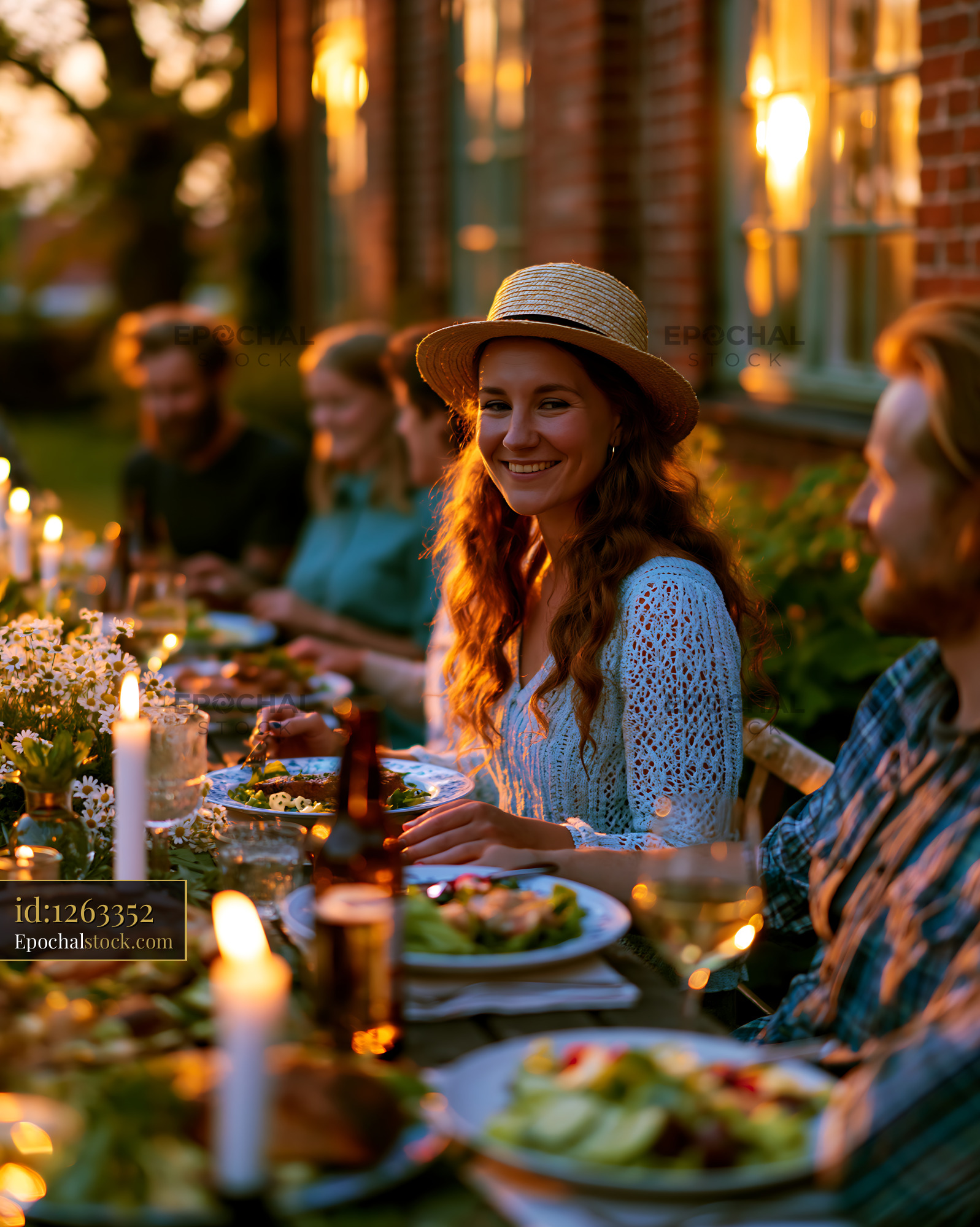 Watermarked full-resolution preview of Gathering at sunset with friends around a table of food