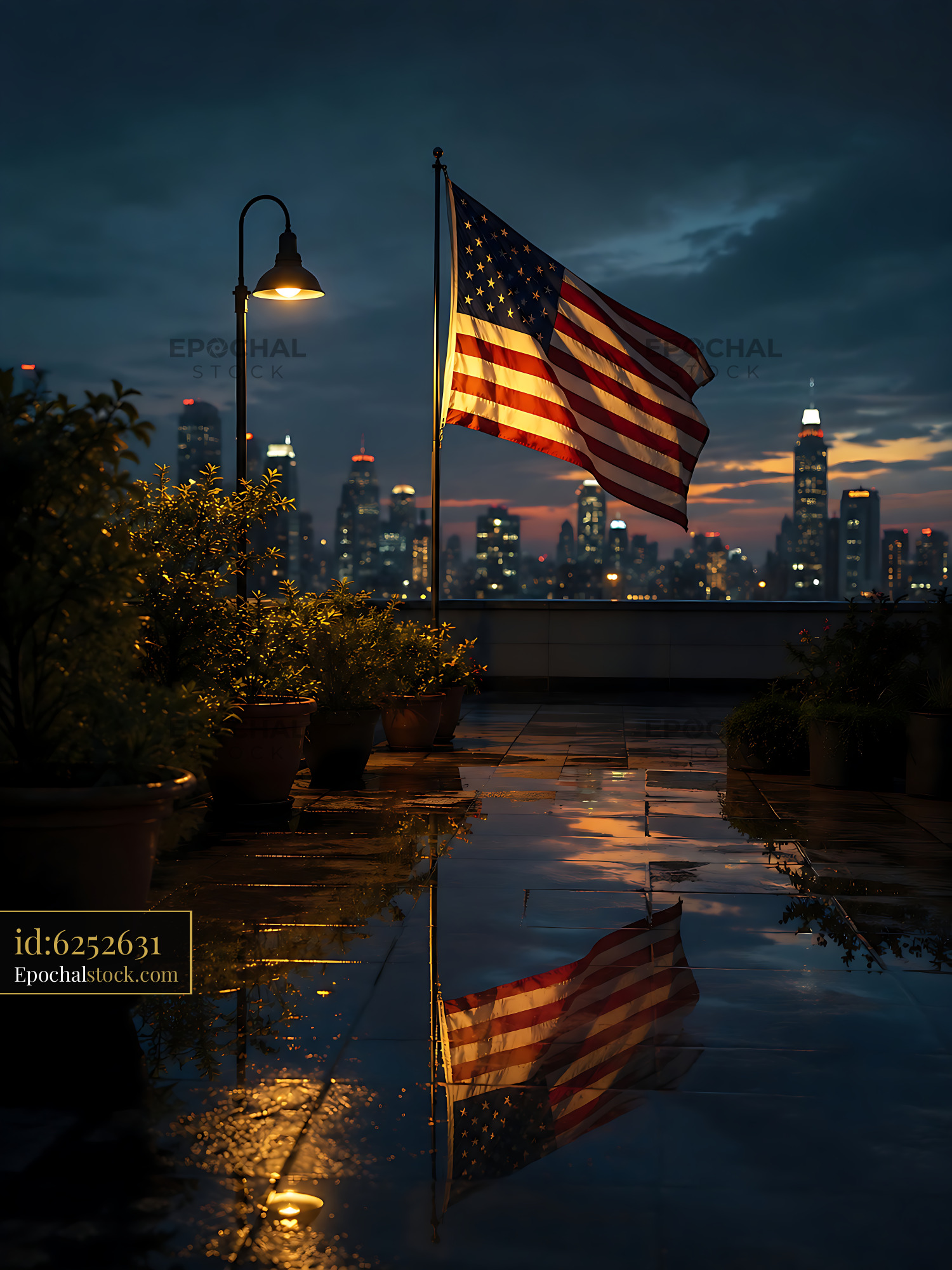 Watermarked full-resolution preview of American flag waving at night on a rooftop with city skyline