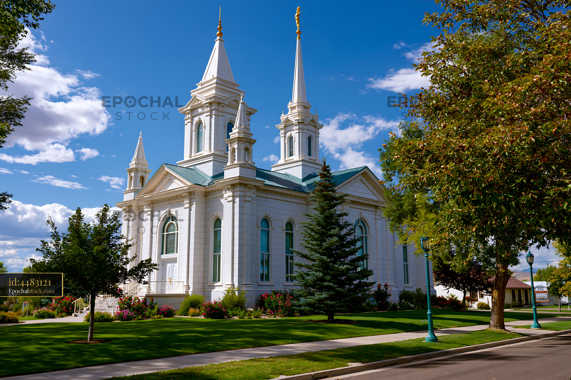 Watermarked full-resolution preview of Historic church building with spires under blue sky