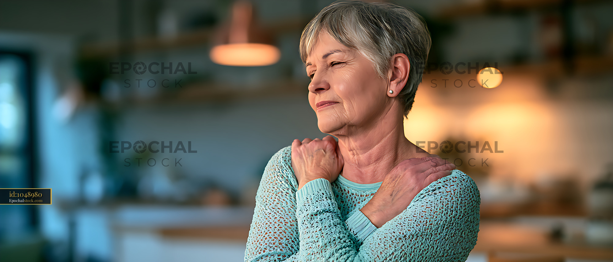 Watermarked full-resolution preview of Mature woman practicing a gentle shoulder stretch indoors