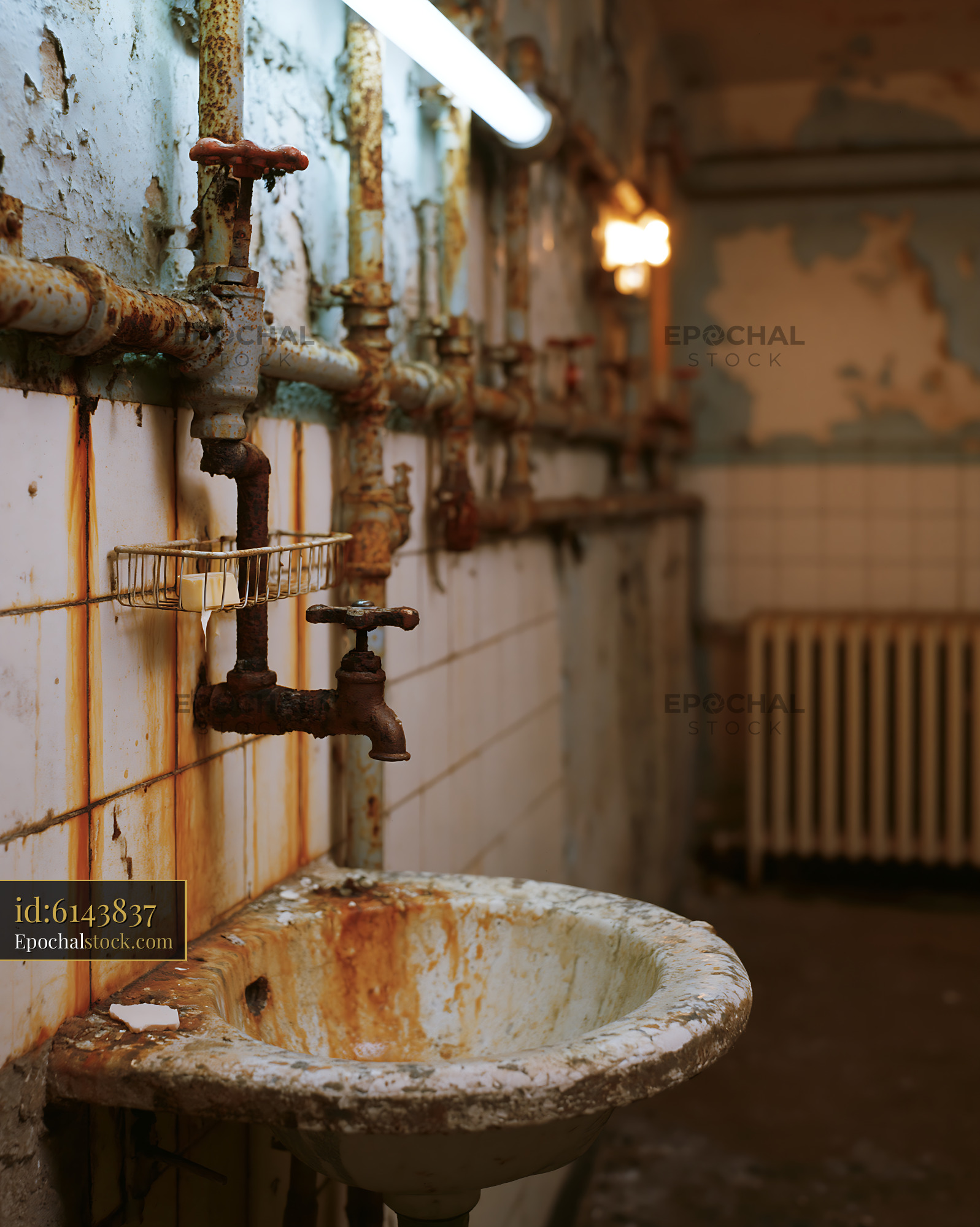 Watermarked full-resolution preview of Rusty sink in an old industrial bathroom space
