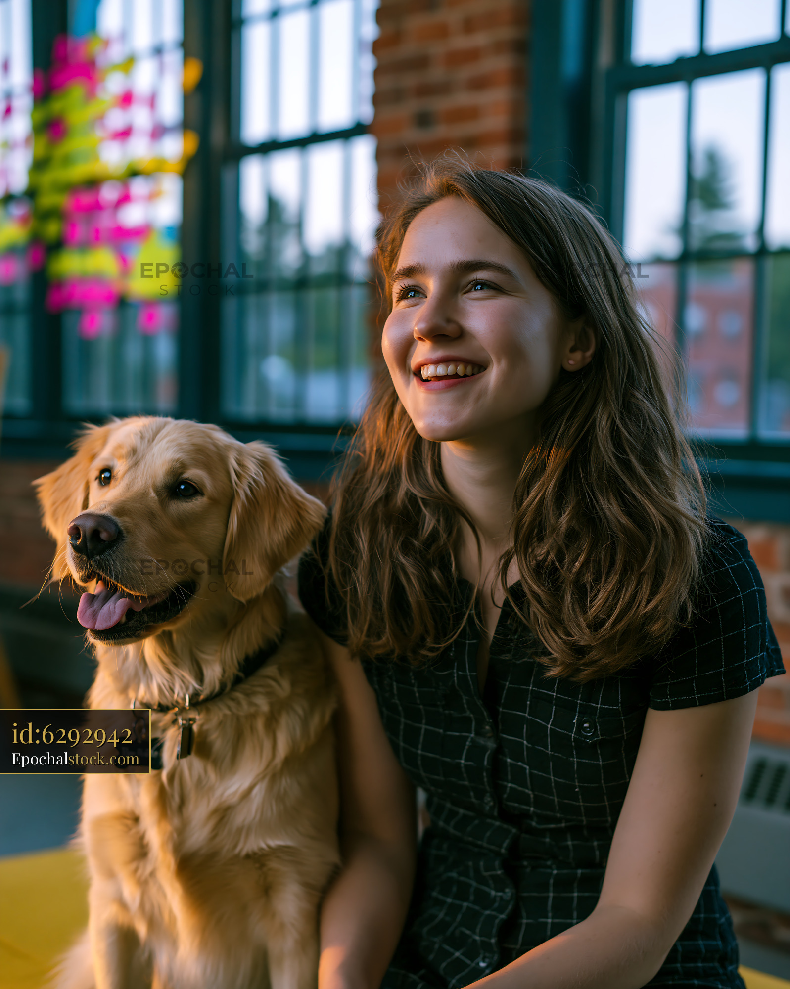 Cheerful Young Woman With Golden Retriever Dog Indoors - stock photo