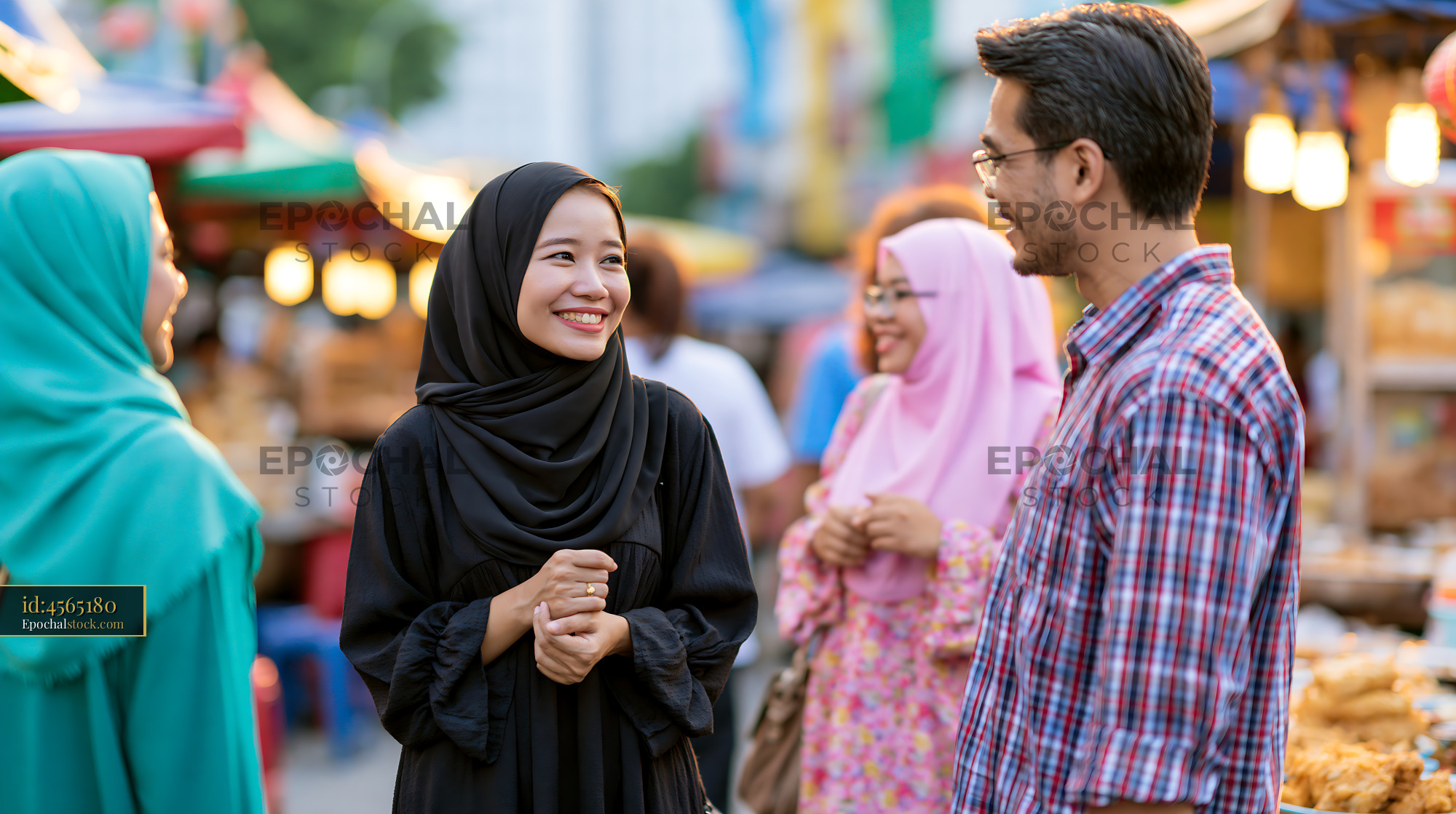 Watermarked full-resolution preview of People enjoying conversation at a vibrant market