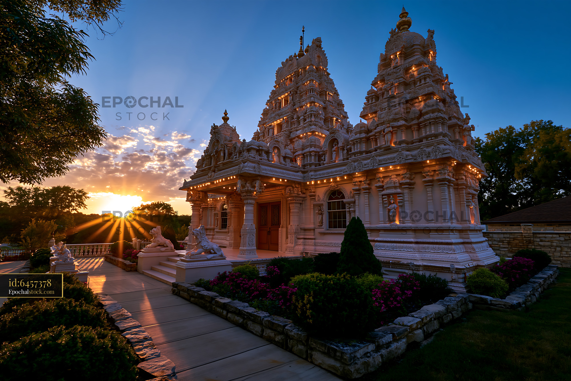 Watermarked full-resolution preview of Sunset over a temple with intricate architecture and garden