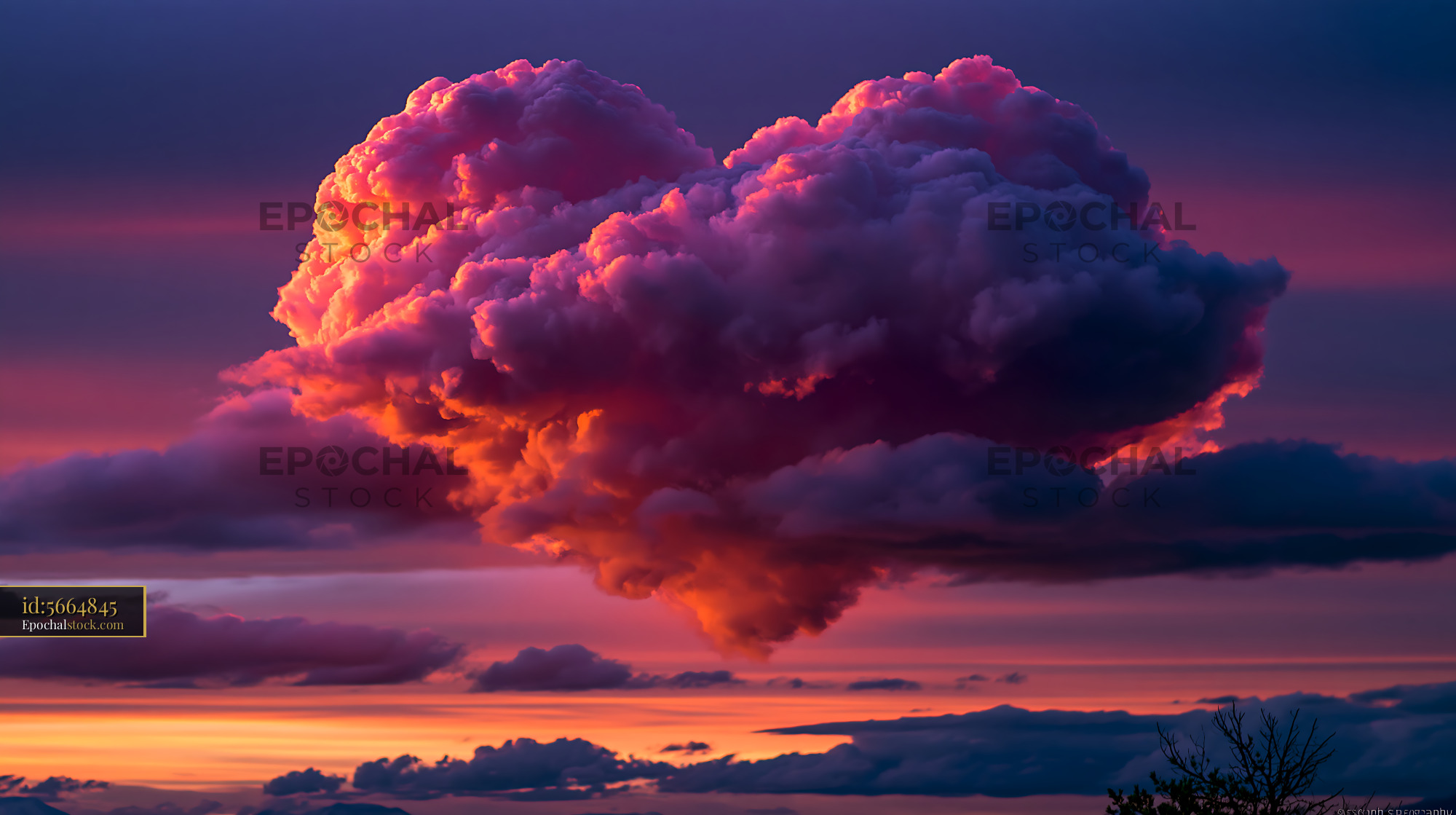 Watermarked full-resolution preview of Towering storm cloud glowing in sunset colors